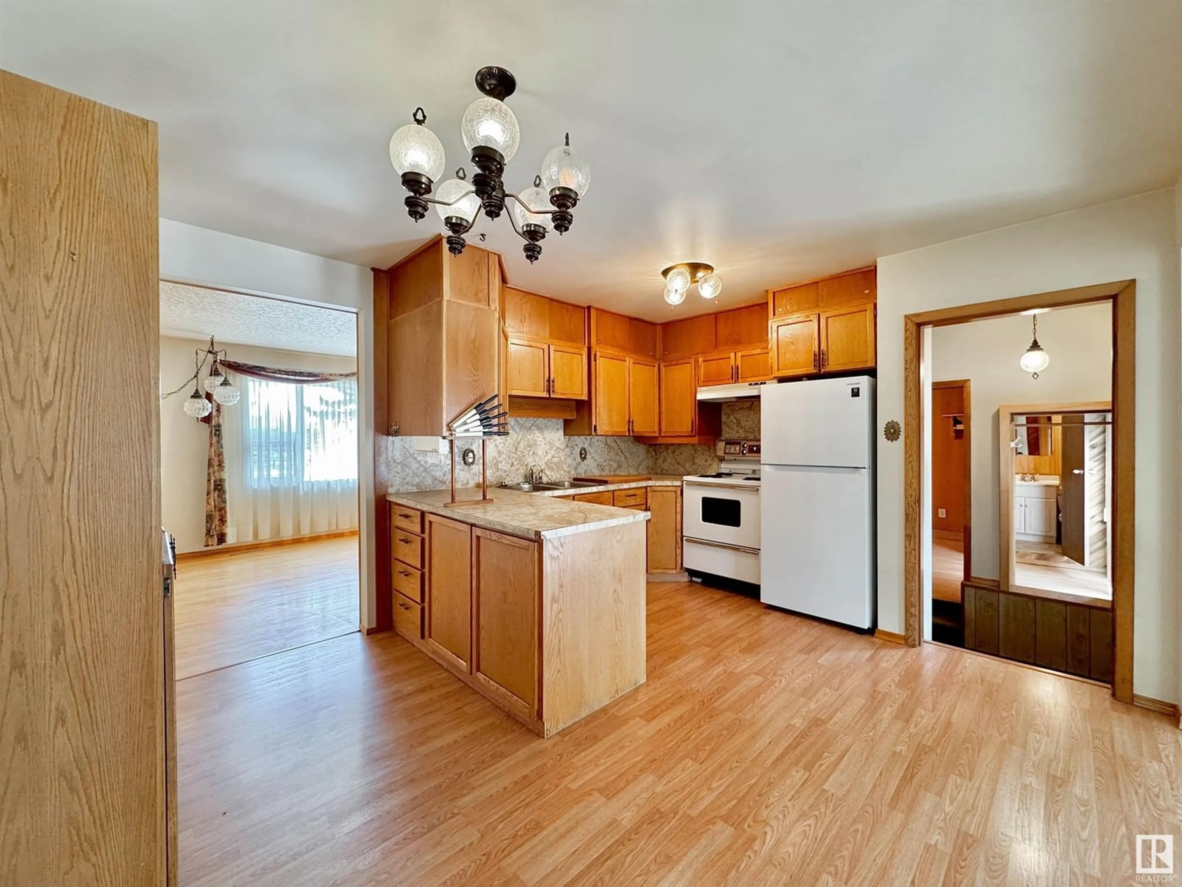 Open concept kitchen, wood/laminate floor for 228 FIR ST, Sherwood Park Alberta T8A2A8