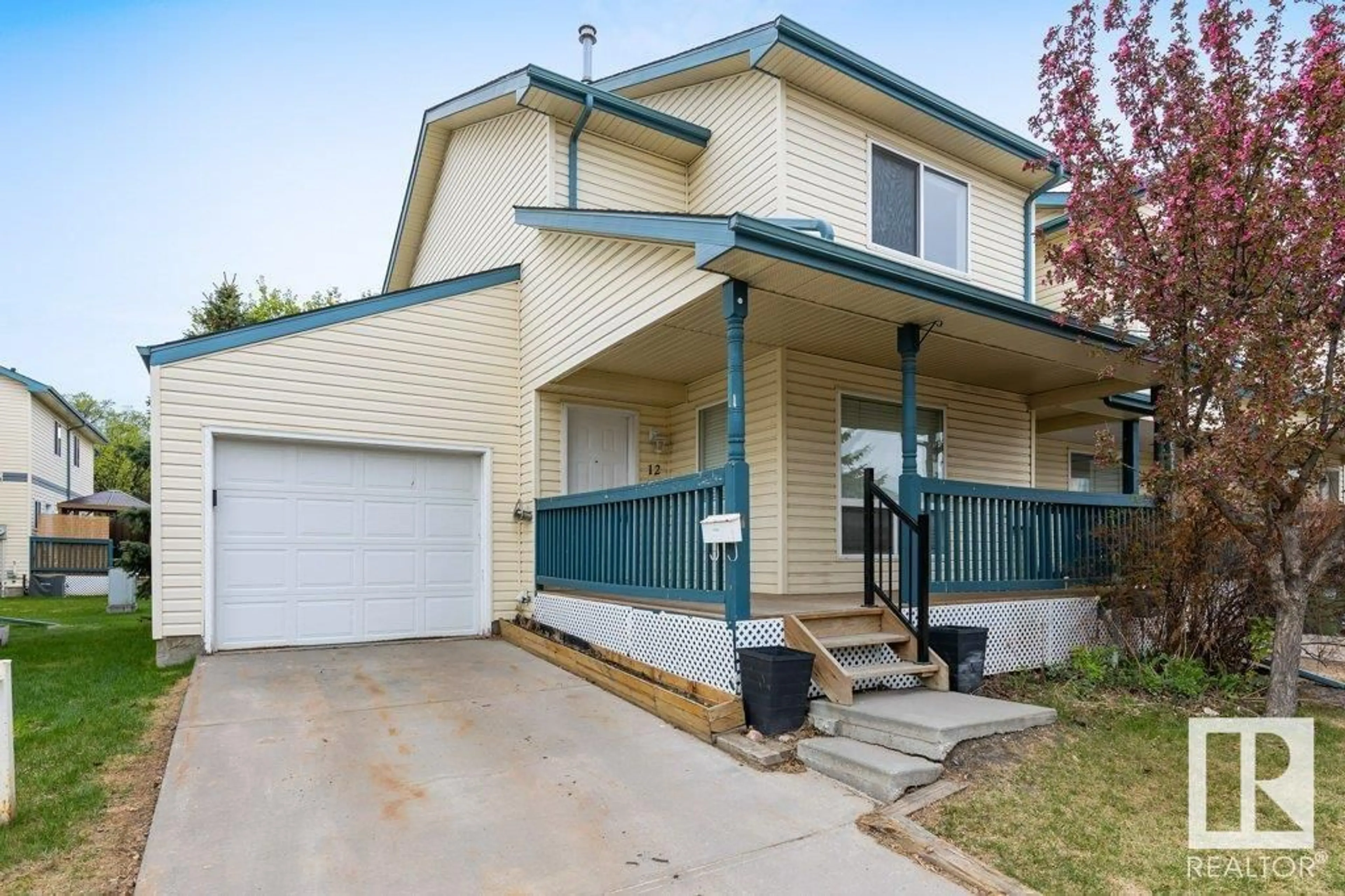 Home with vinyl exterior material, street for 12 10909 106 ST NW, Edmonton Alberta T5H4M7
