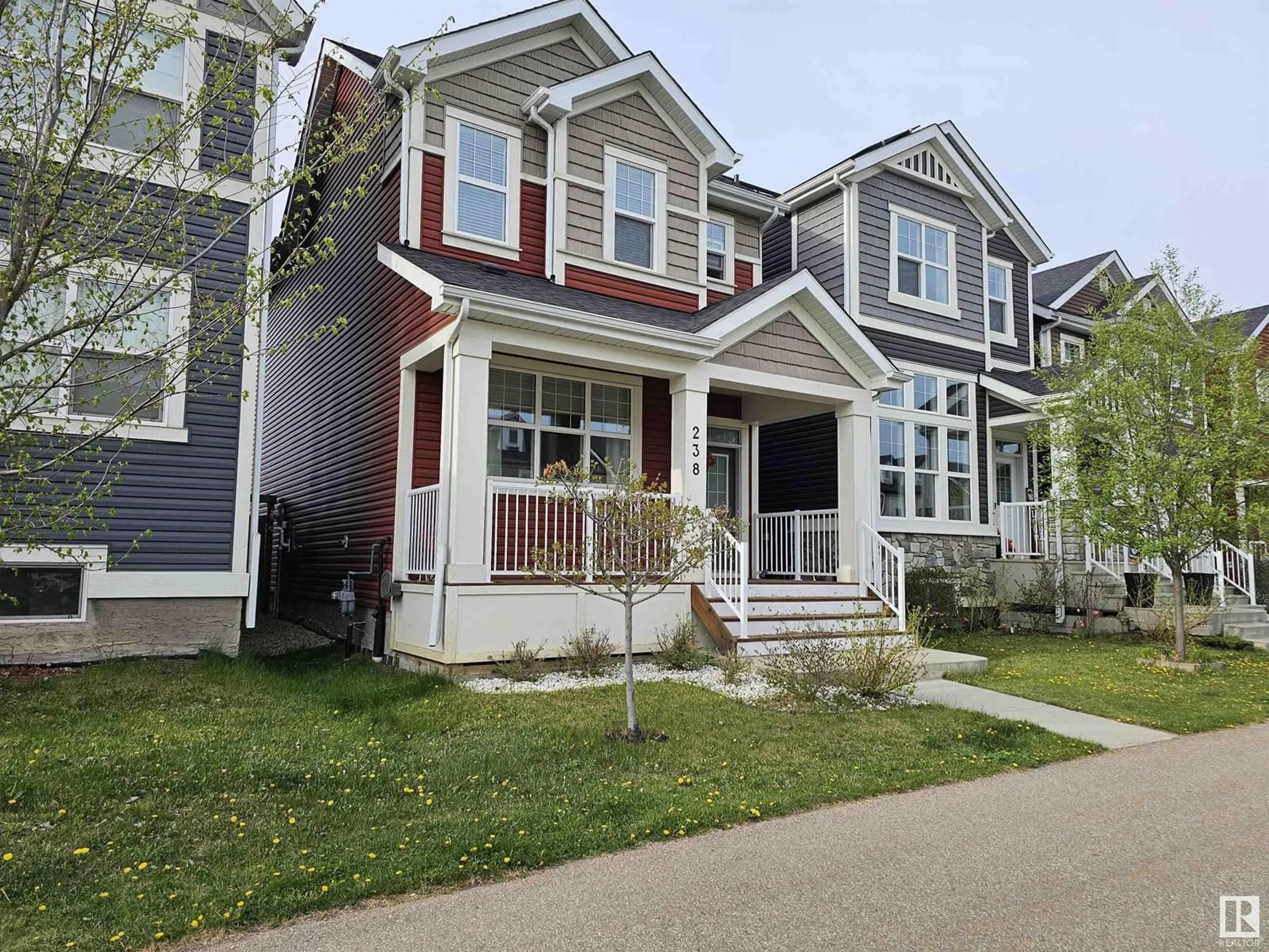 Home with vinyl exterior material, street for 238 SOUTHFORK DR, Leduc Alberta T9E1G3
