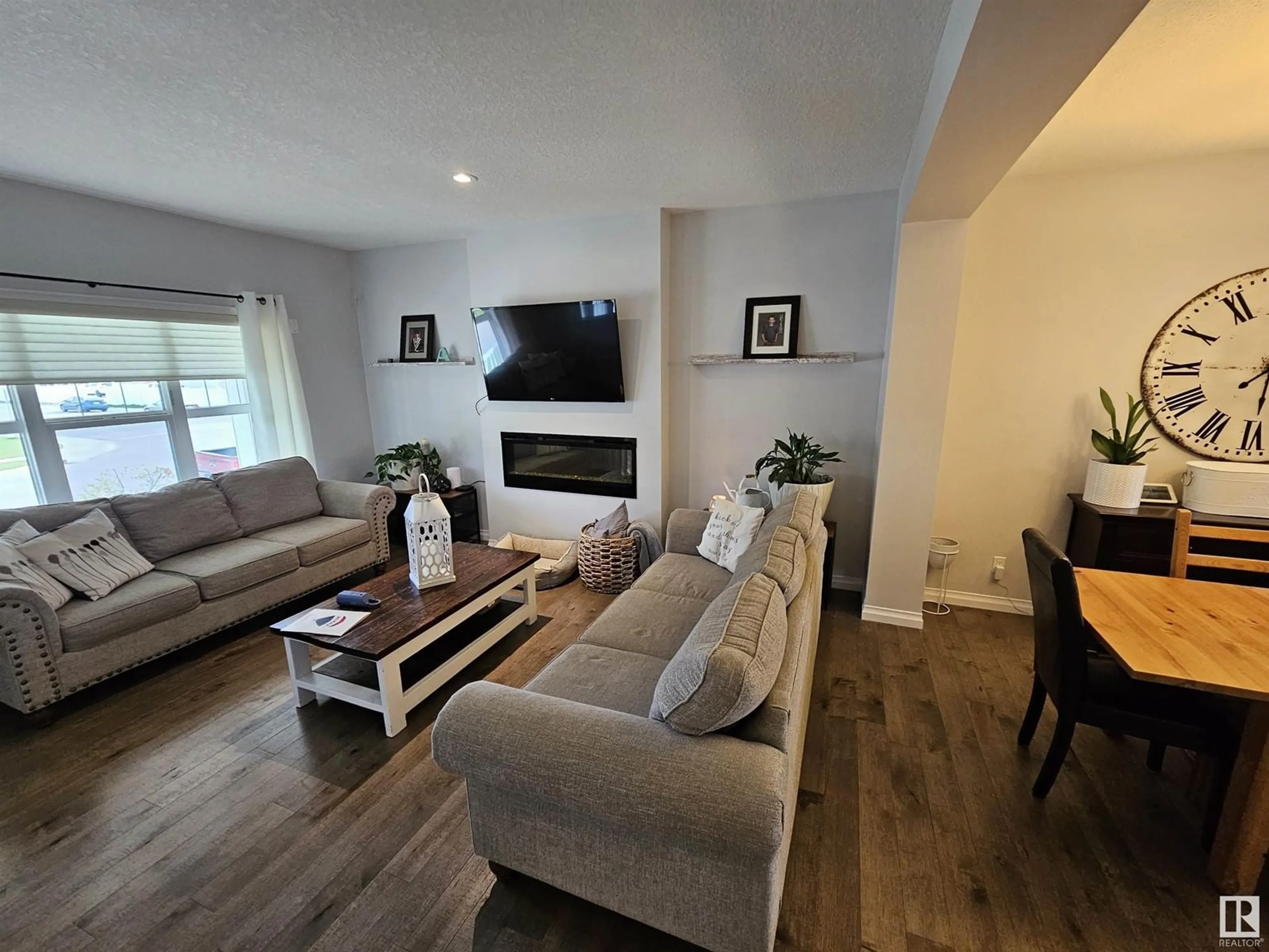 Living room with furniture, wood/laminate floor for 238 SOUTHFORK DR, Leduc Alberta T9E1G3