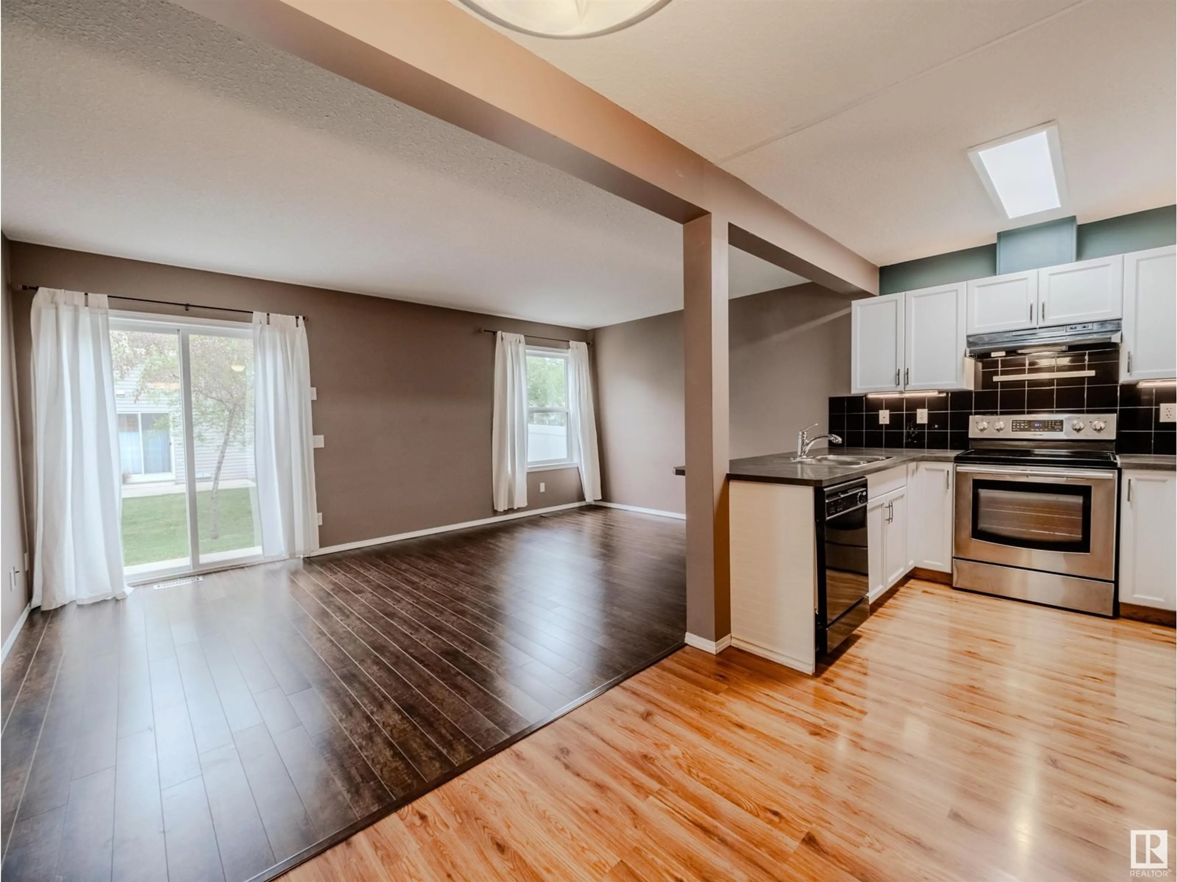 Open concept kitchen, wood/laminate floor for SW - 66 230 EDWARDS DR, Edmonton Alberta T6X1G7