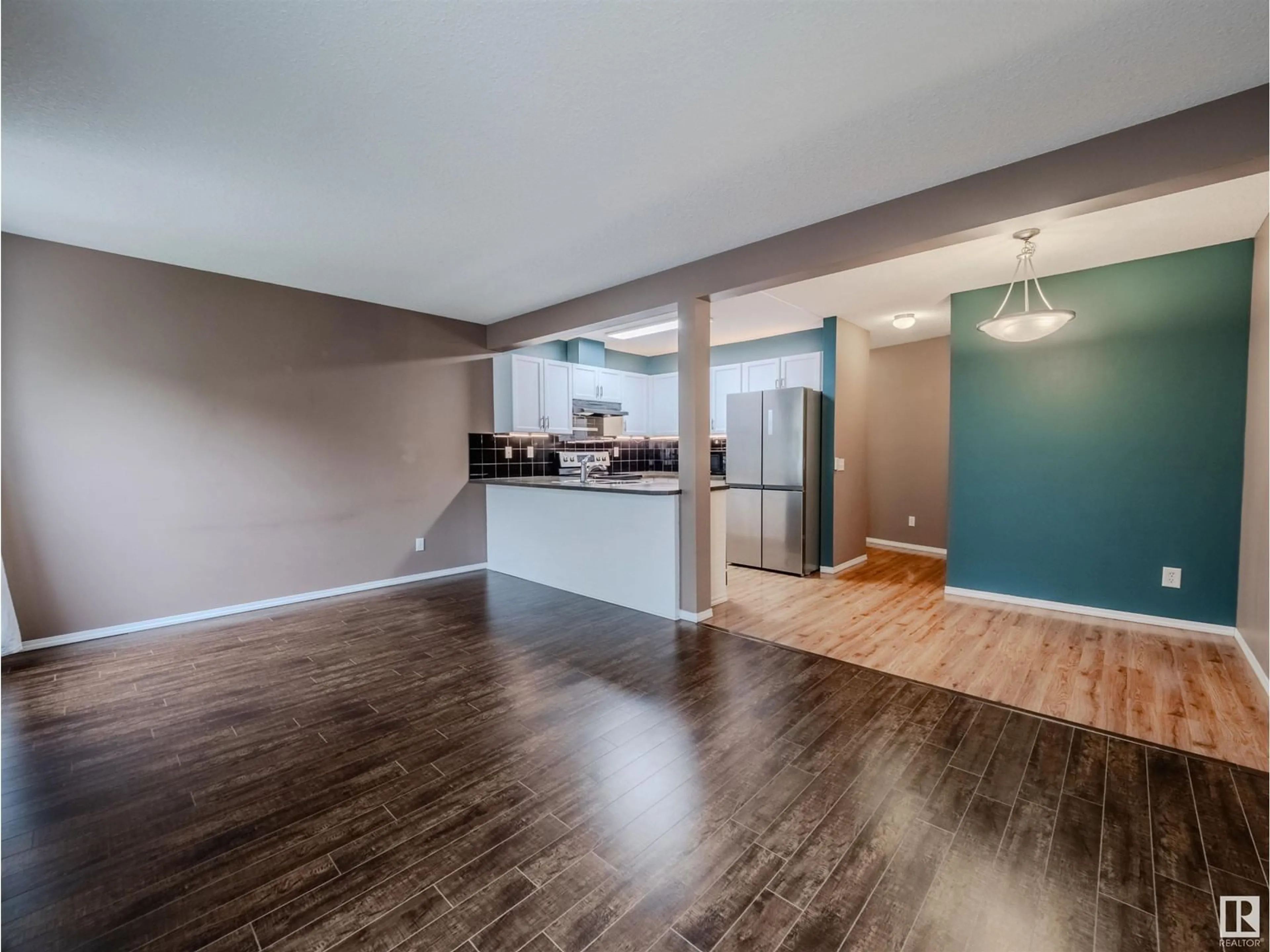 Open concept kitchen, wood/laminate floor for SW - 66 230 EDWARDS DR, Edmonton Alberta T6X1G7