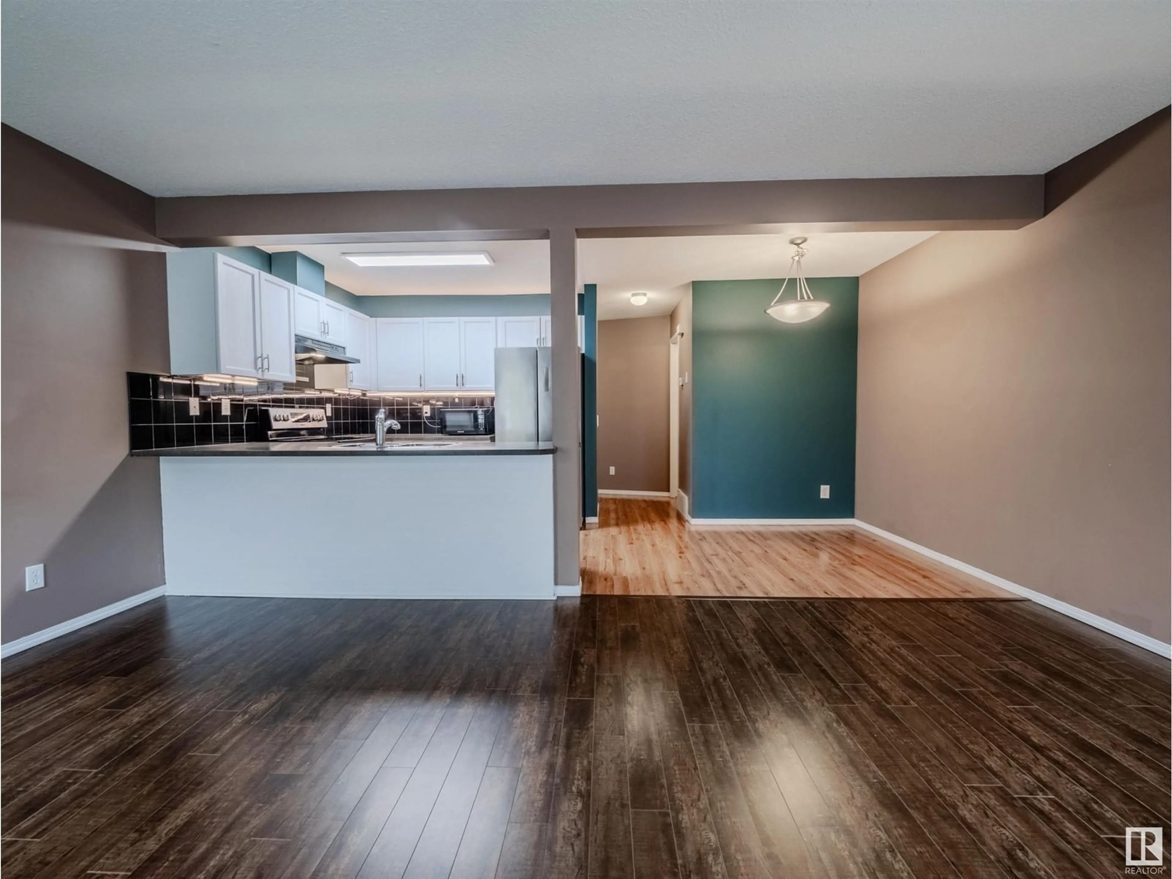 Open concept kitchen, wood/laminate floor for SW - 66 230 EDWARDS DR, Edmonton Alberta T6X1G7