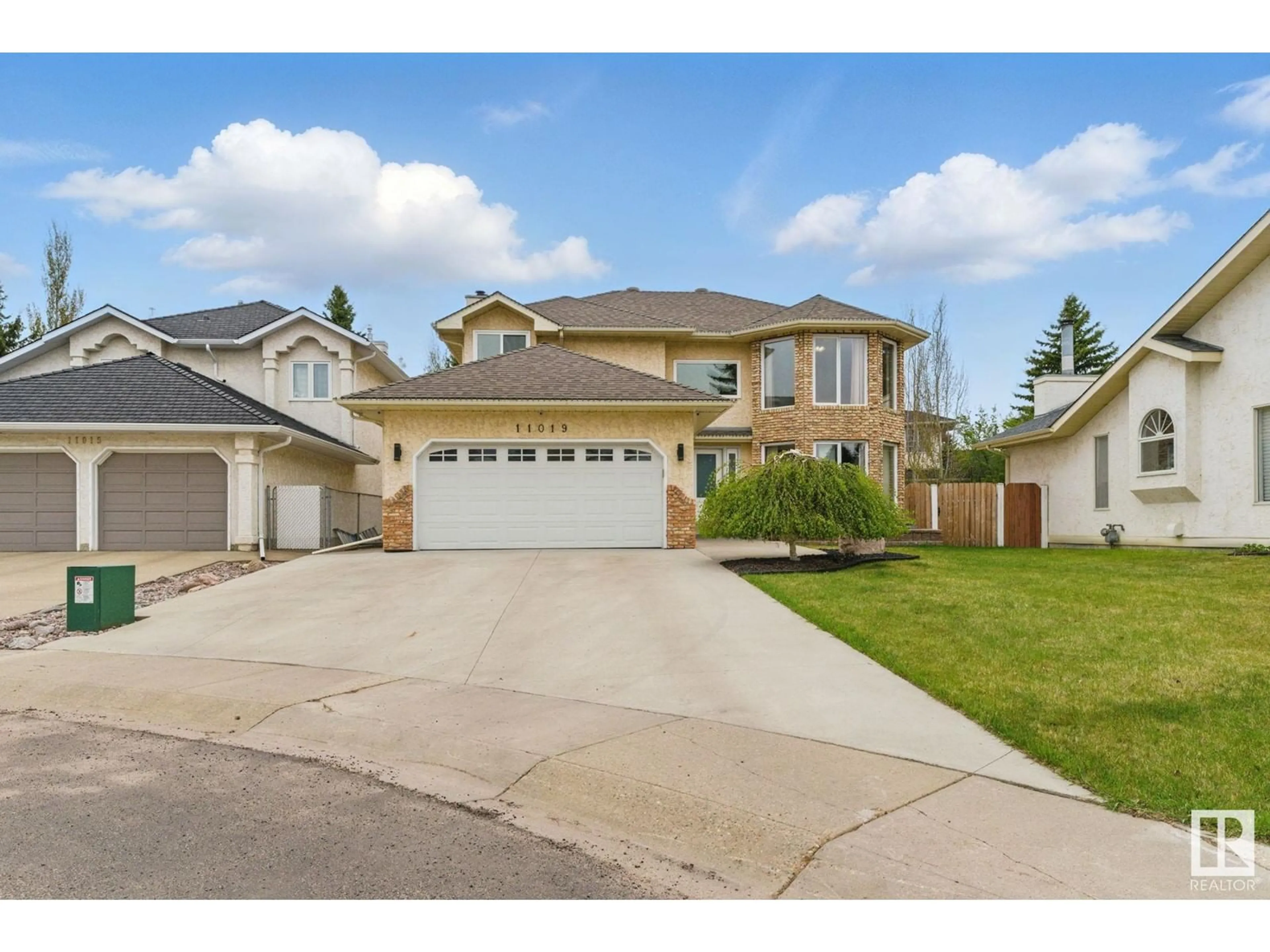 Home with vinyl exterior material, street for NW - 11019 10 AV, Edmonton Alberta T6J6N4