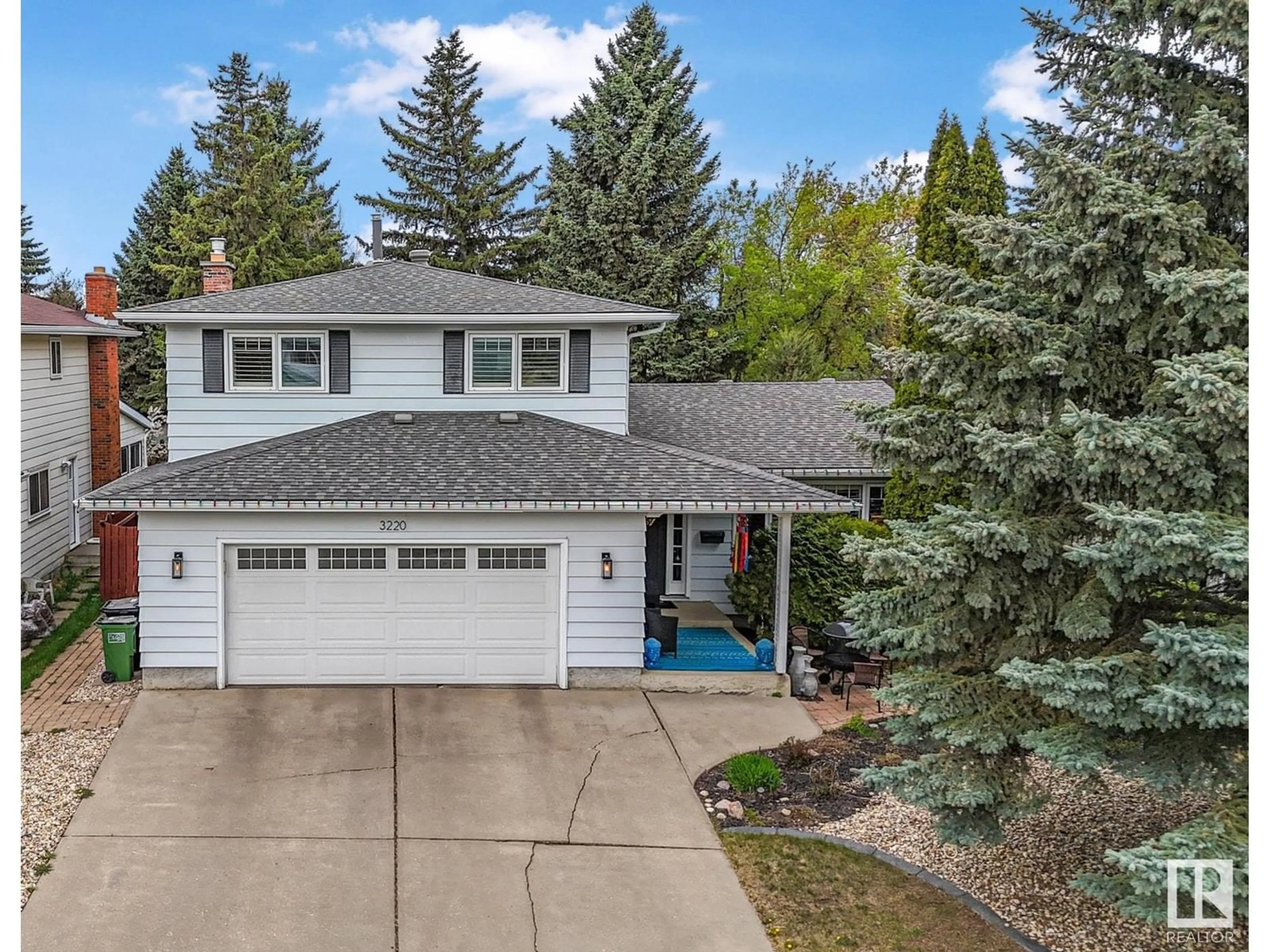 Home with vinyl exterior material, street for NW - 3220 112B ST, Edmonton Alberta T5J3W5
