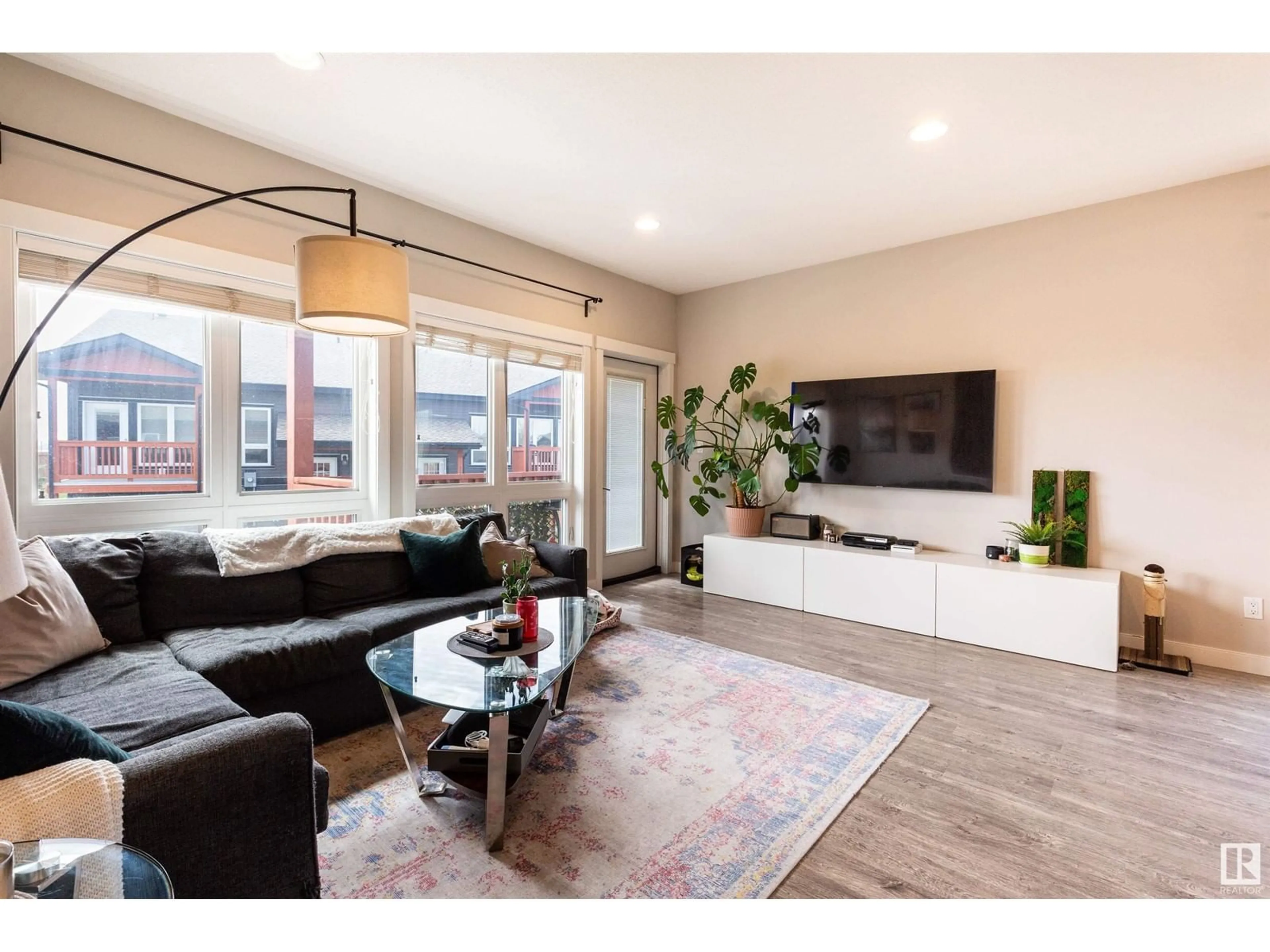 Living room with furniture, wood/laminate floor for 1603 GRAYBRIAR GR, Stony Plain Alberta T7Z0G1