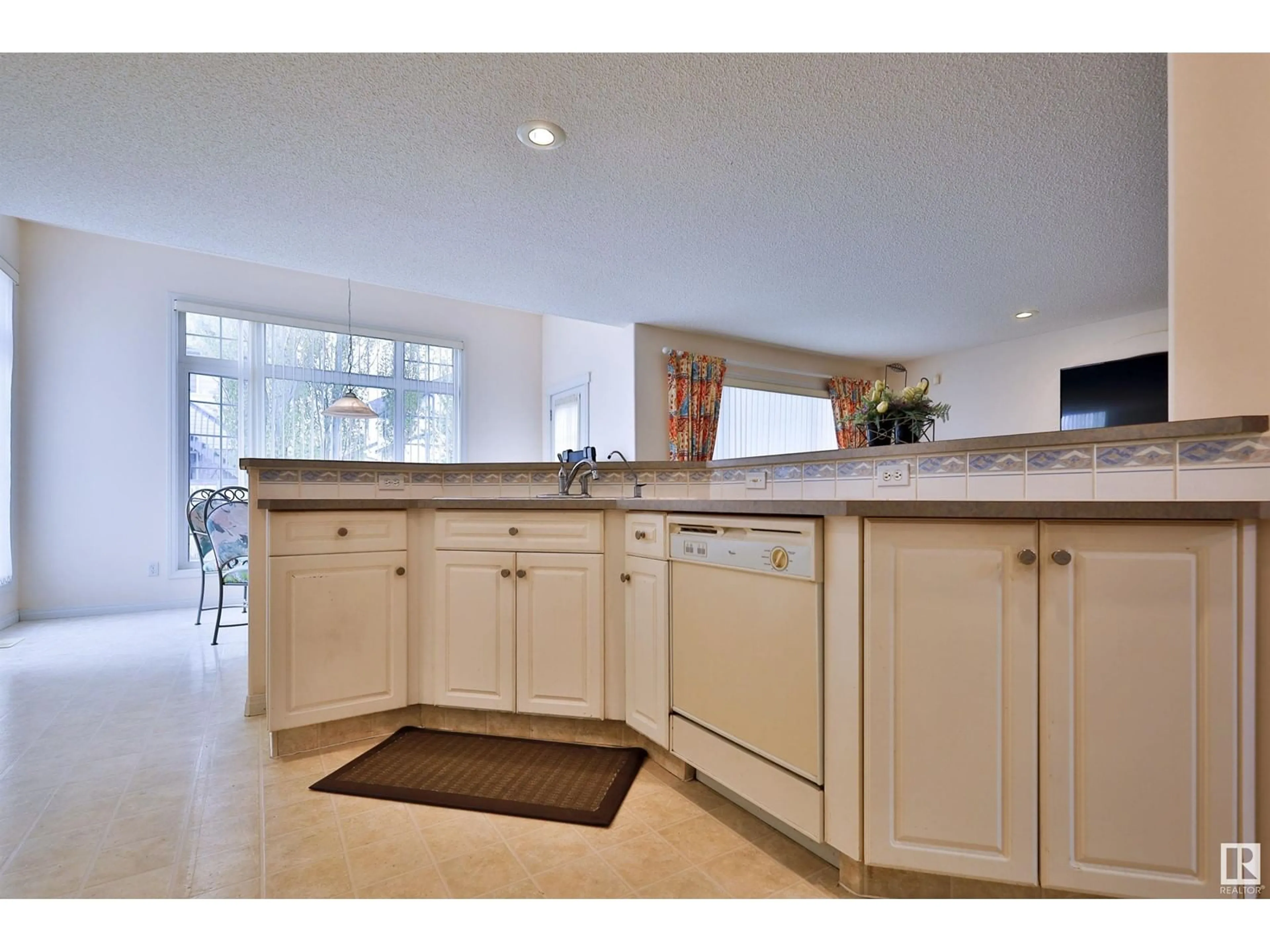 Open concept kitchen, ceramic/tile floor for 4109 37 AV, Edmonton Alberta T6L7B2
