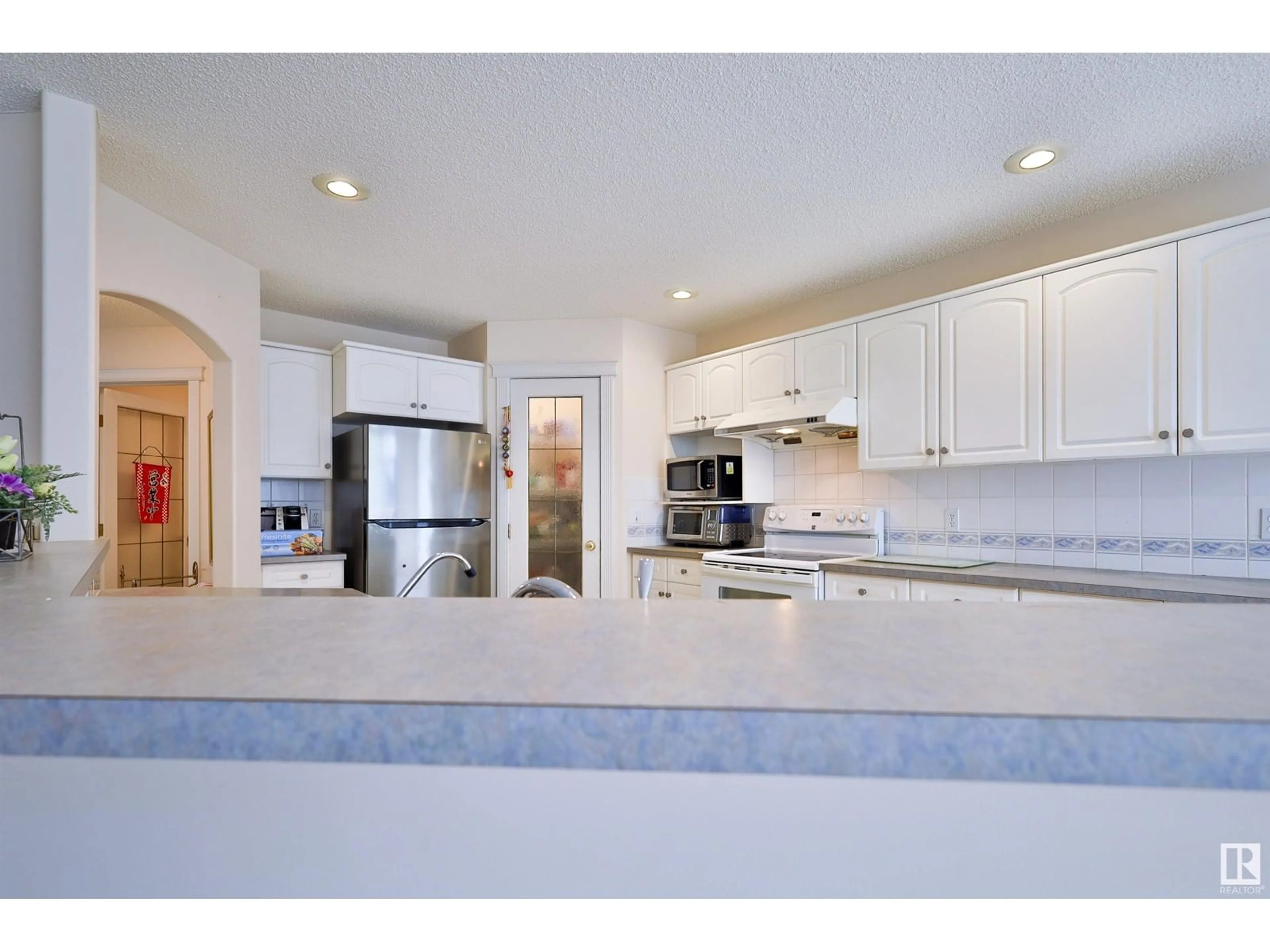 Open concept kitchen, ceramic/tile floor for 4109 37 AV, Edmonton Alberta T6L7B2