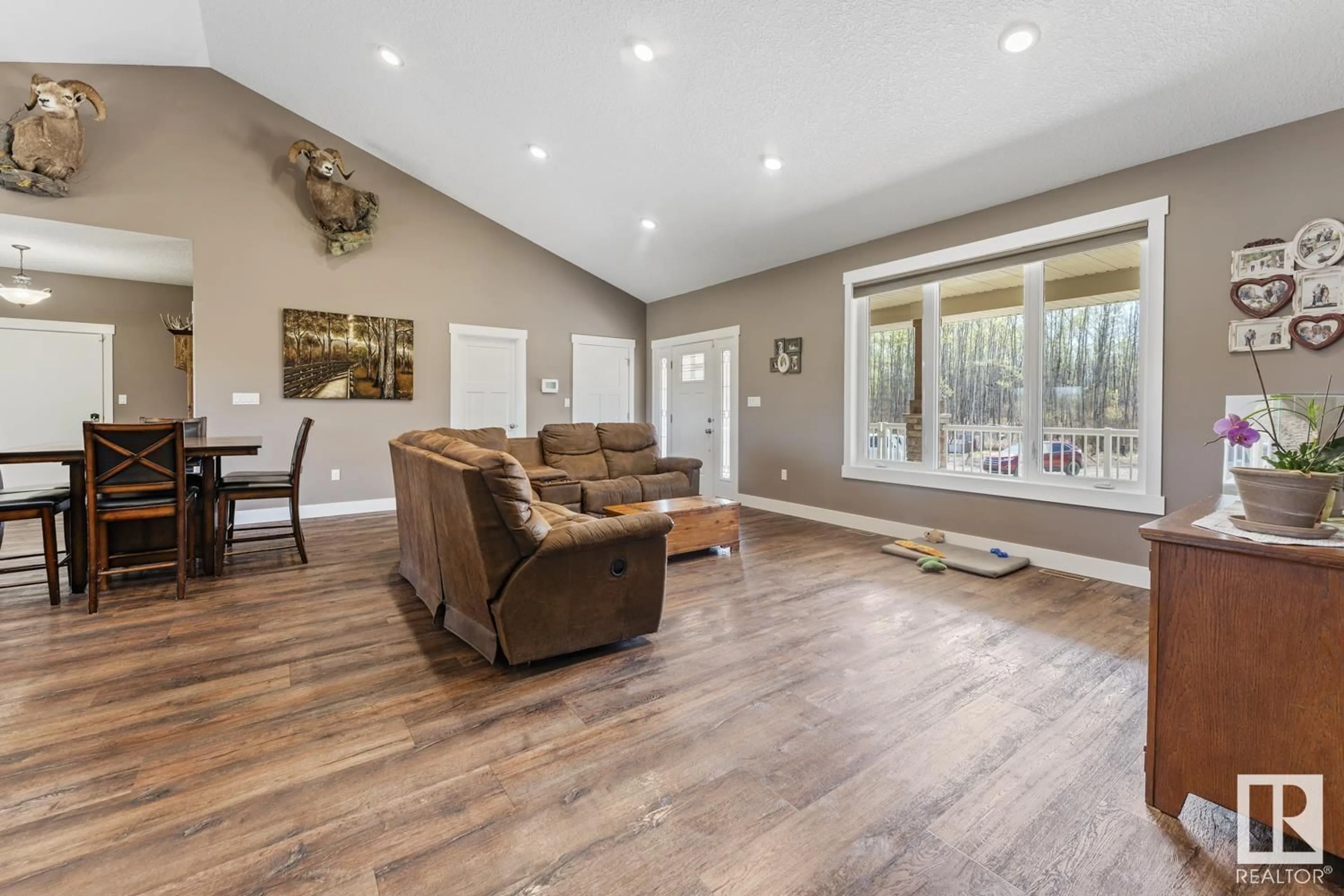 Living room with furniture, wood/laminate floor for 44426 TWP RD 595 A, Rural Bonnyville M.D. Alberta T9N2J6
