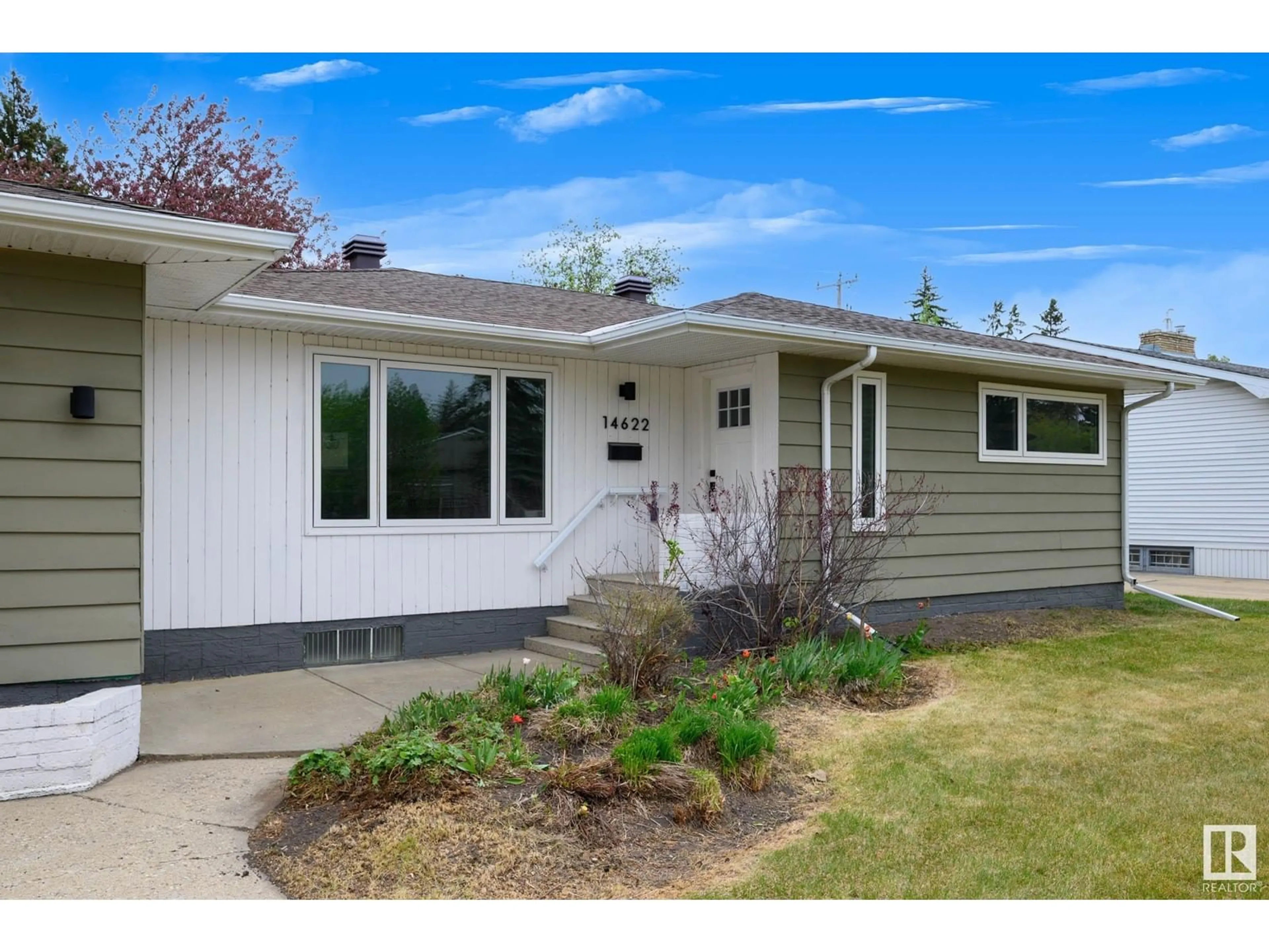 Home with vinyl exterior material, street for 14622 95 AV, Edmonton Alberta T5N0B3