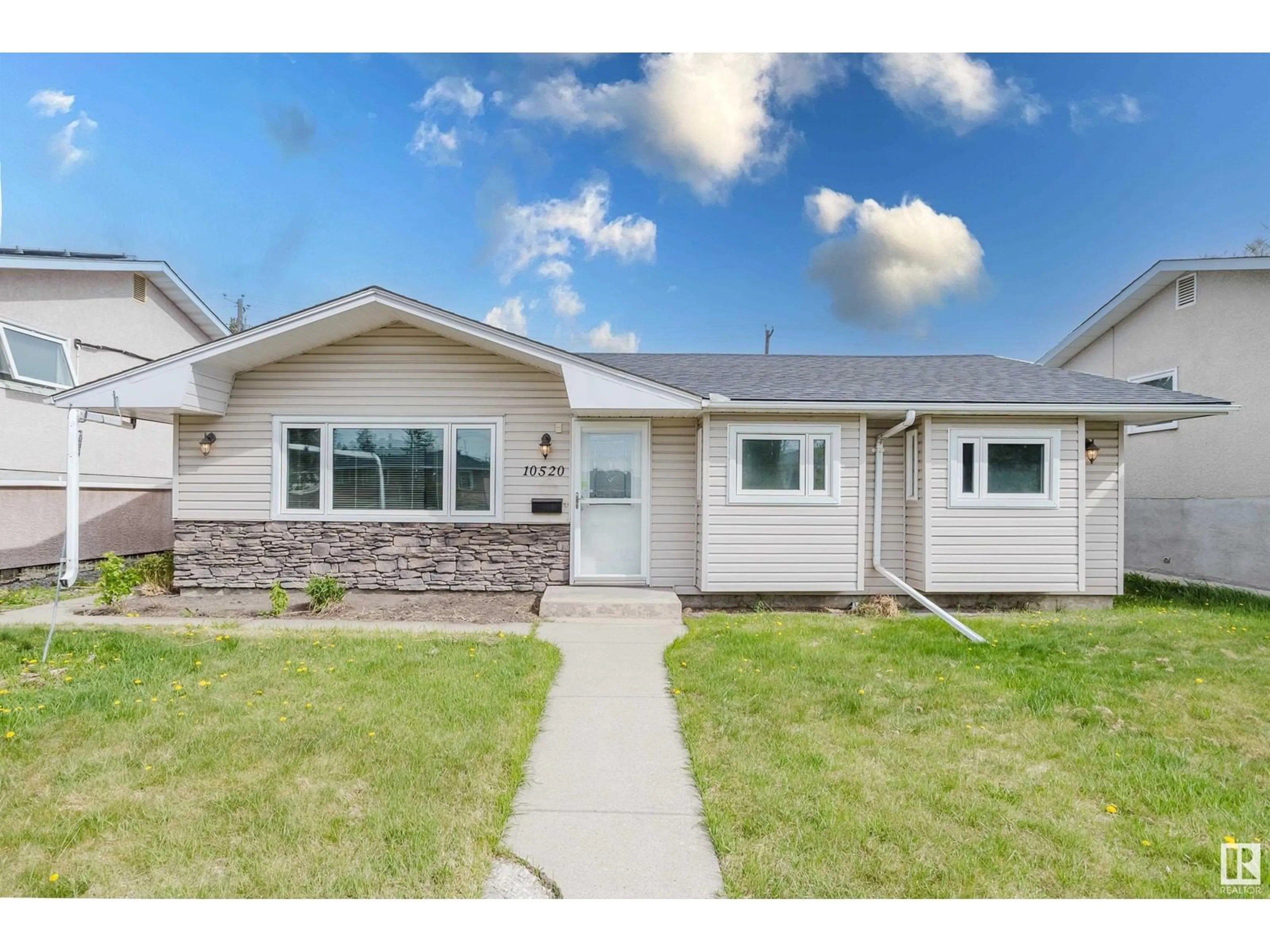 Home with vinyl exterior material, street for 10520 52 AV, Edmonton Alberta T6H0P1