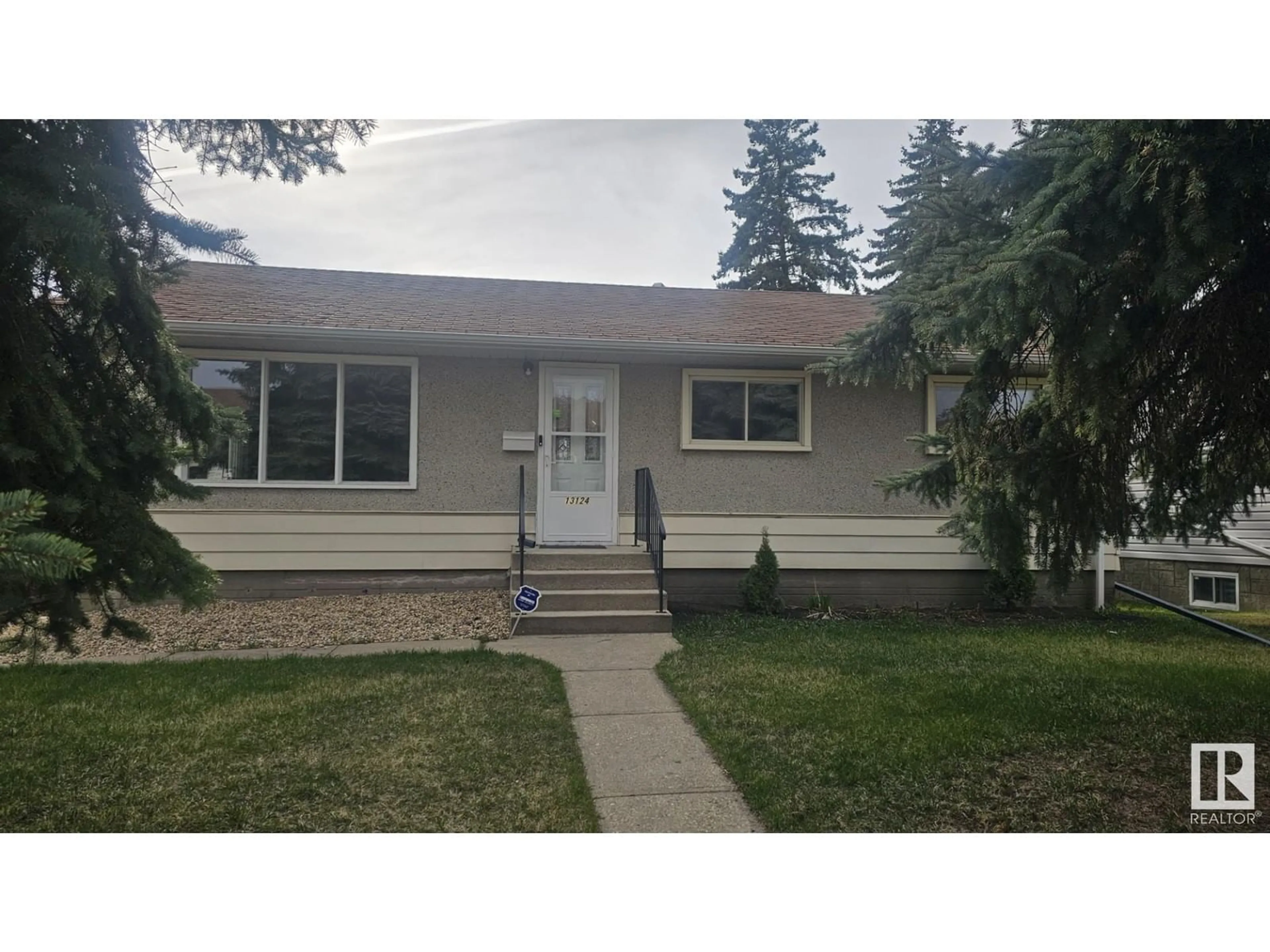 Home with vinyl exterior material, street for NW - 13124 83 ST, Edmonton Alberta T5E2W6