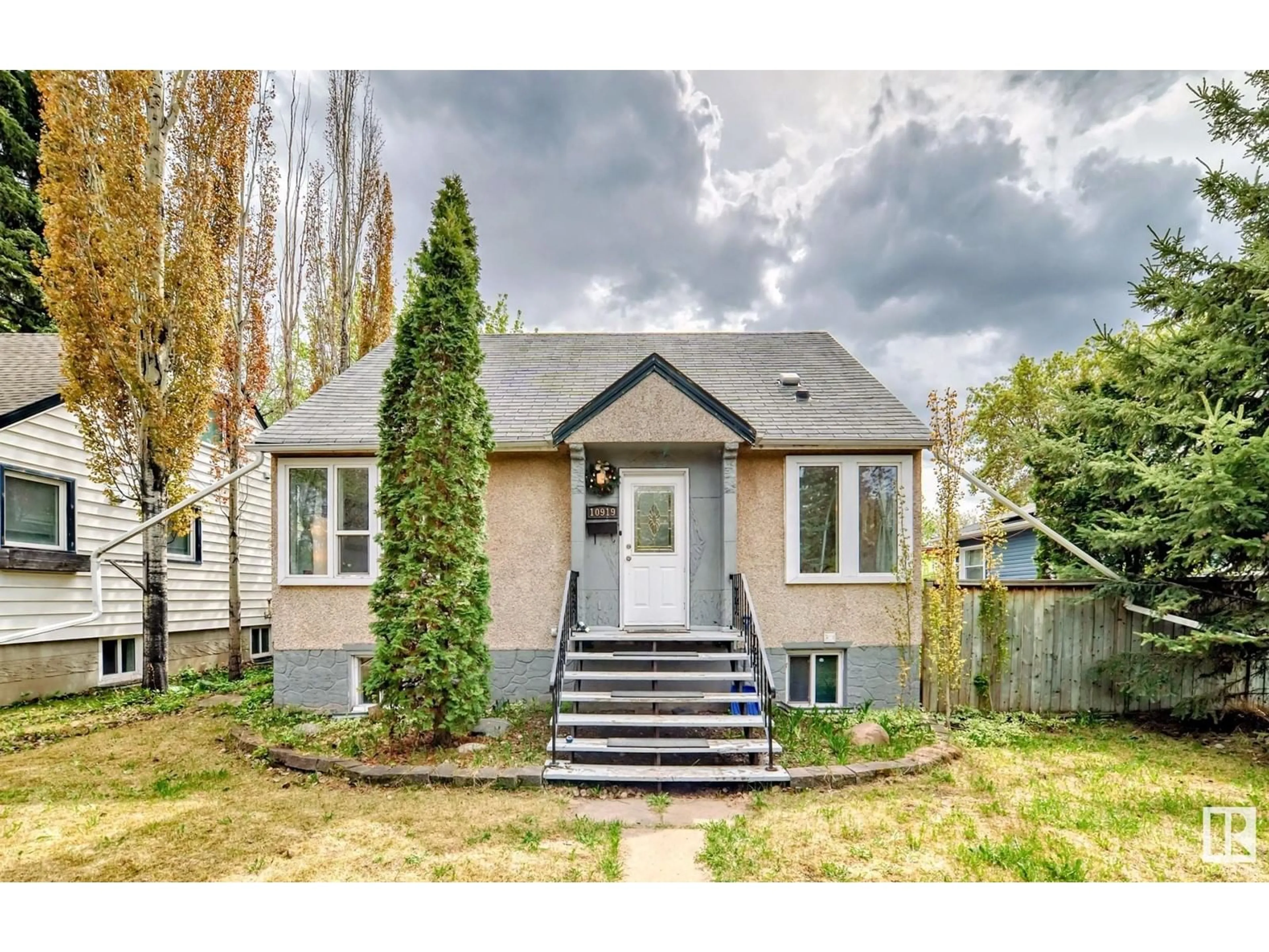 Home with vinyl exterior material, street for 10919 67 AV, Edmonton Alberta T6H2A5