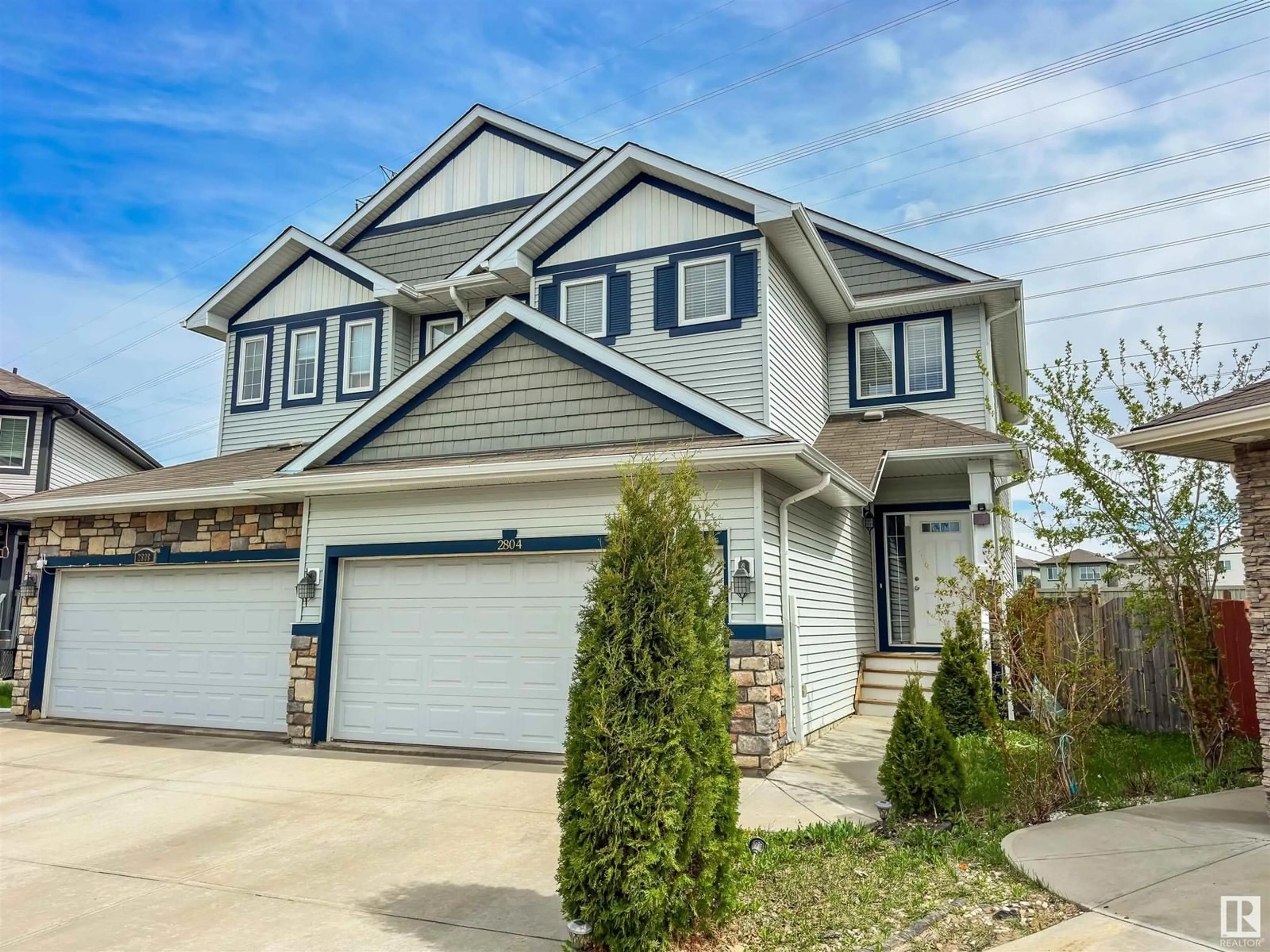 Home with vinyl exterior material, street for 2804 16 AV, Edmonton Alberta T6T0Z6