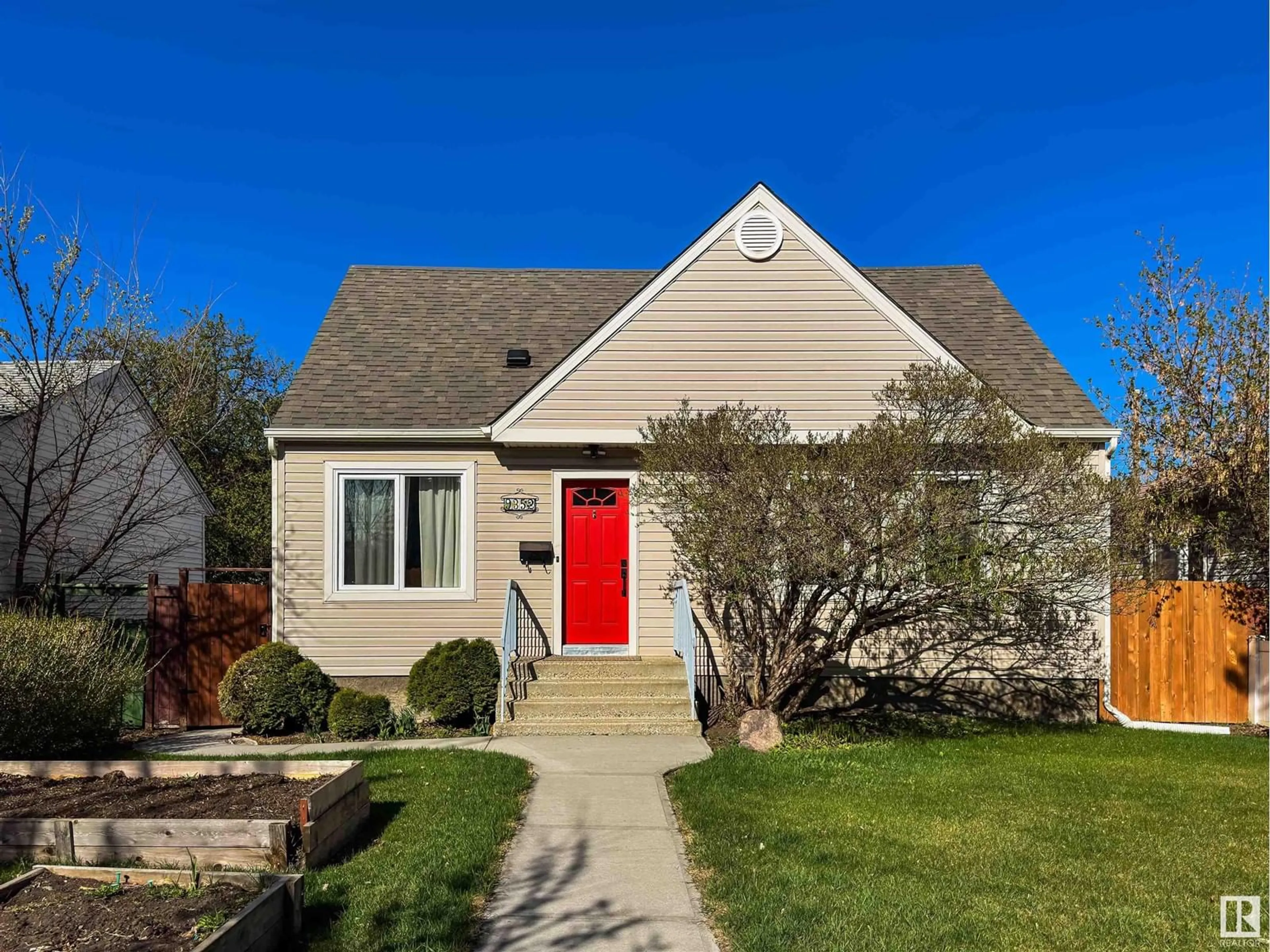 Home with vinyl exterior material, street for 9352 85 ST, Edmonton Alberta T6C3C8