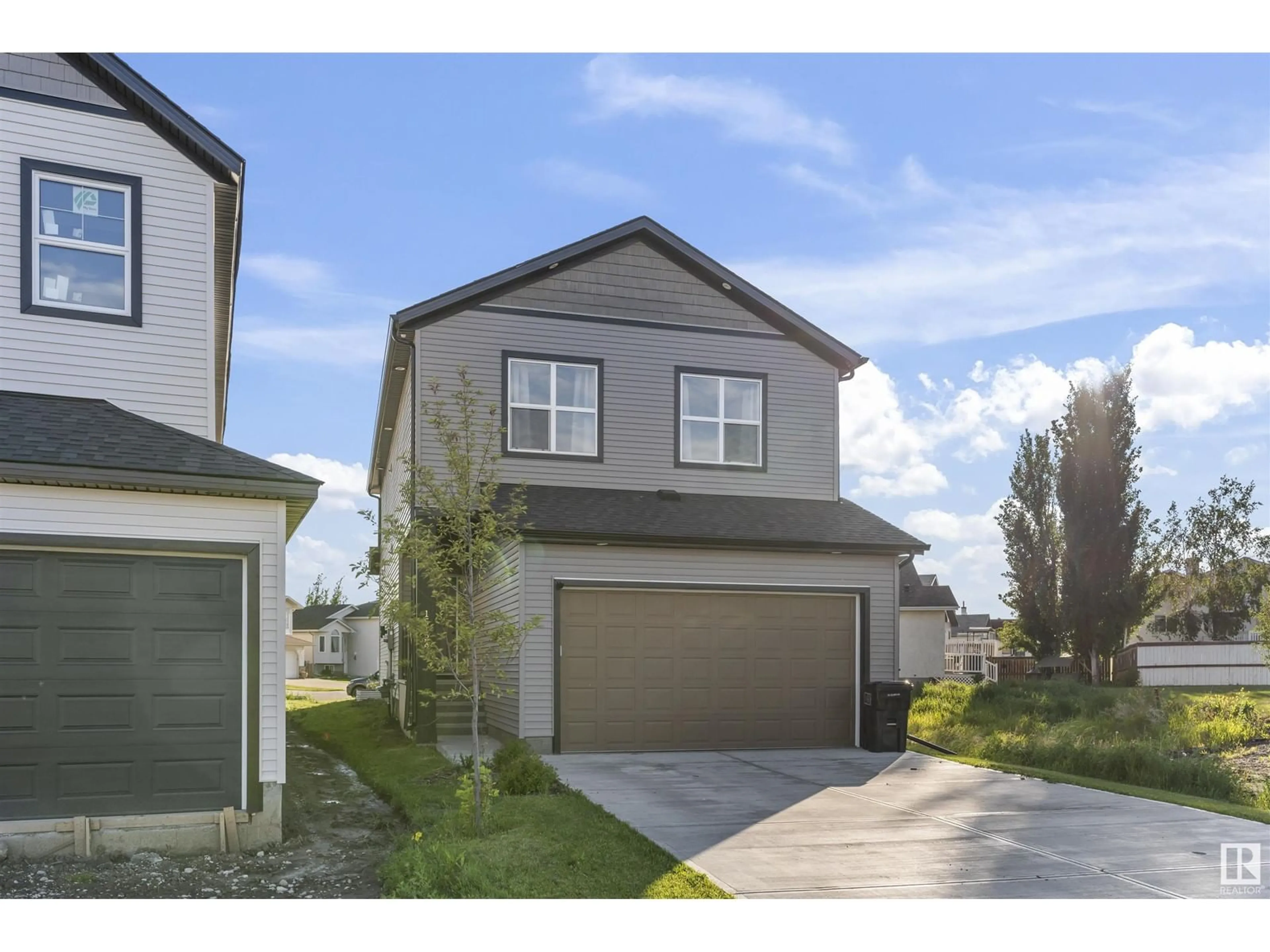 Home with vinyl exterior material, street for NW - 15124 28 ST, Edmonton Alberta T5Y3Y7