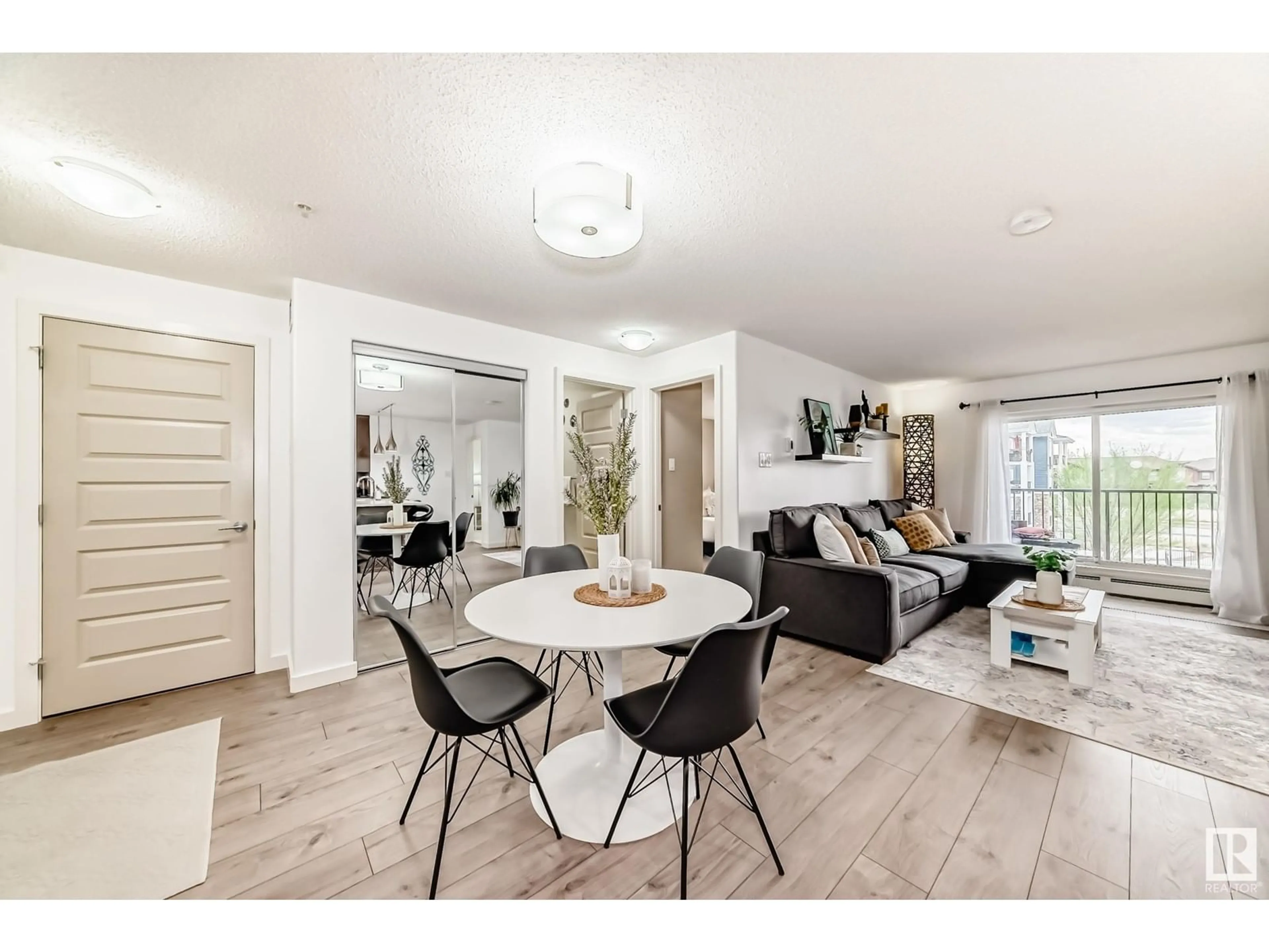 Living room with furniture, unknown for #306 - 4008 SAVARYN DR, Edmonton Alberta T6X2E5
