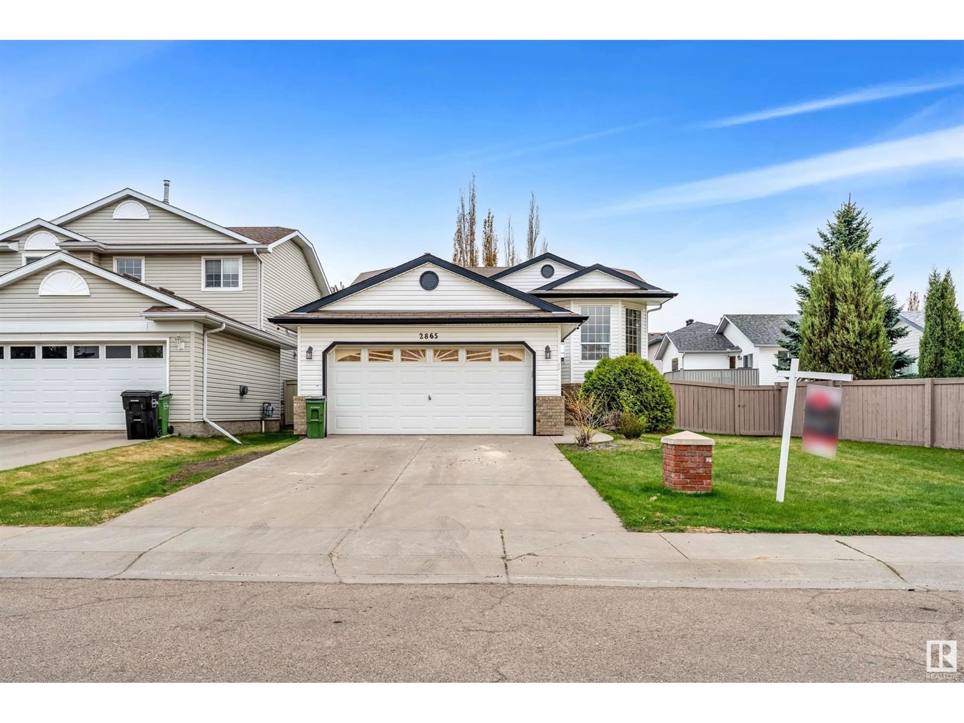 Home with vinyl exterior material, street for NW - 2865 41 AVE, Edmonton Alberta T6T1M4