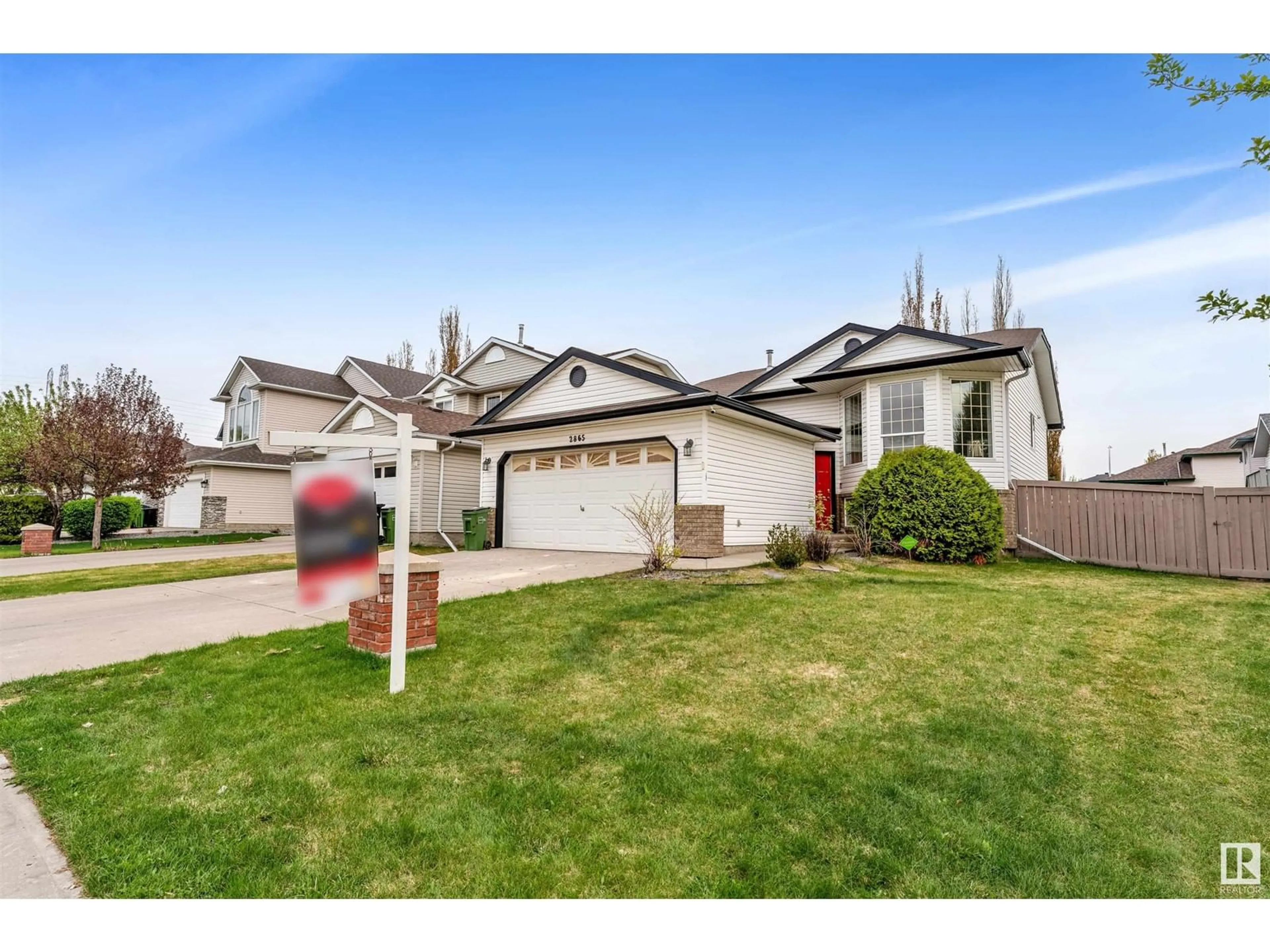 Home with vinyl exterior material, street for NW - 2865 41 AVE, Edmonton Alberta T6T1M4