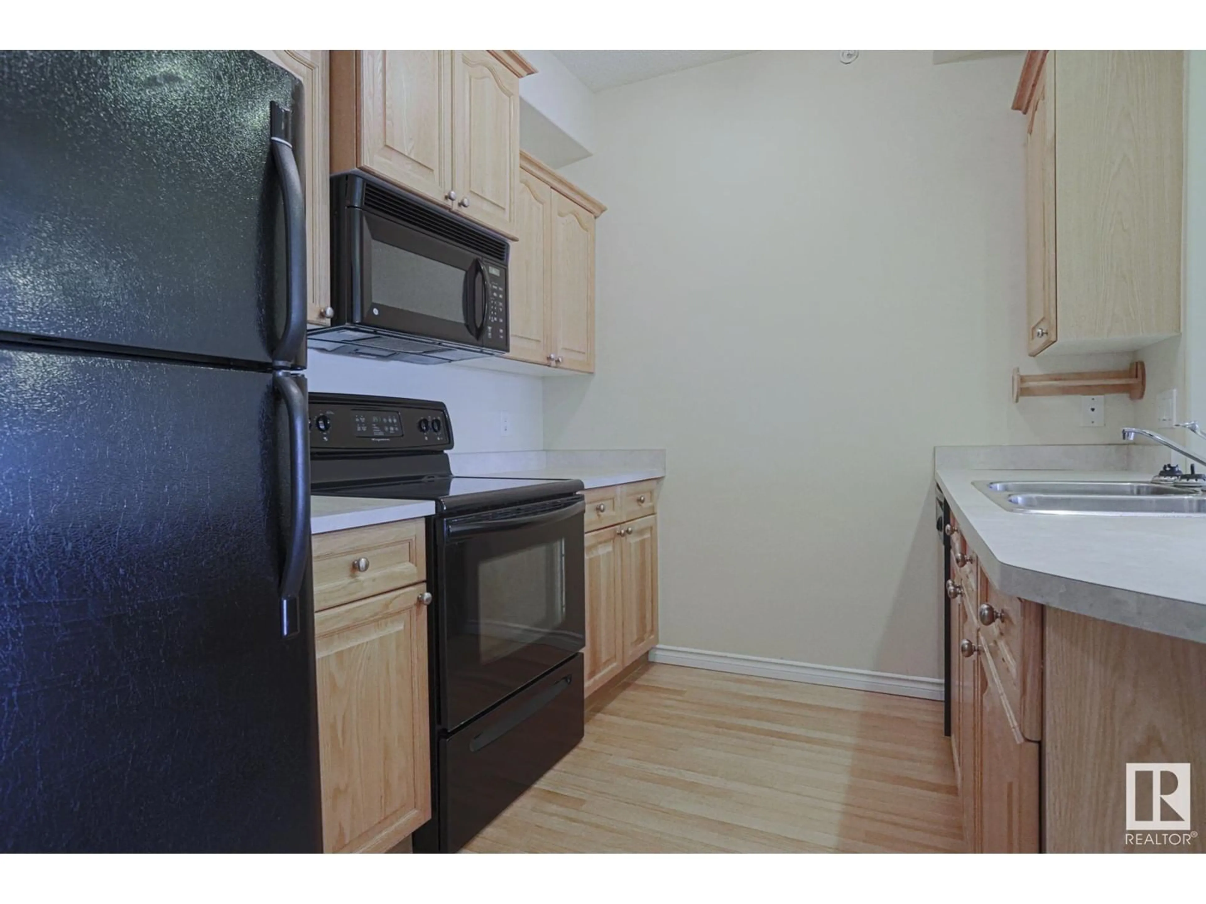 Standard kitchen, wood/laminate floor for #421 - 14259 50 ST, Edmonton Alberta T5A5J2