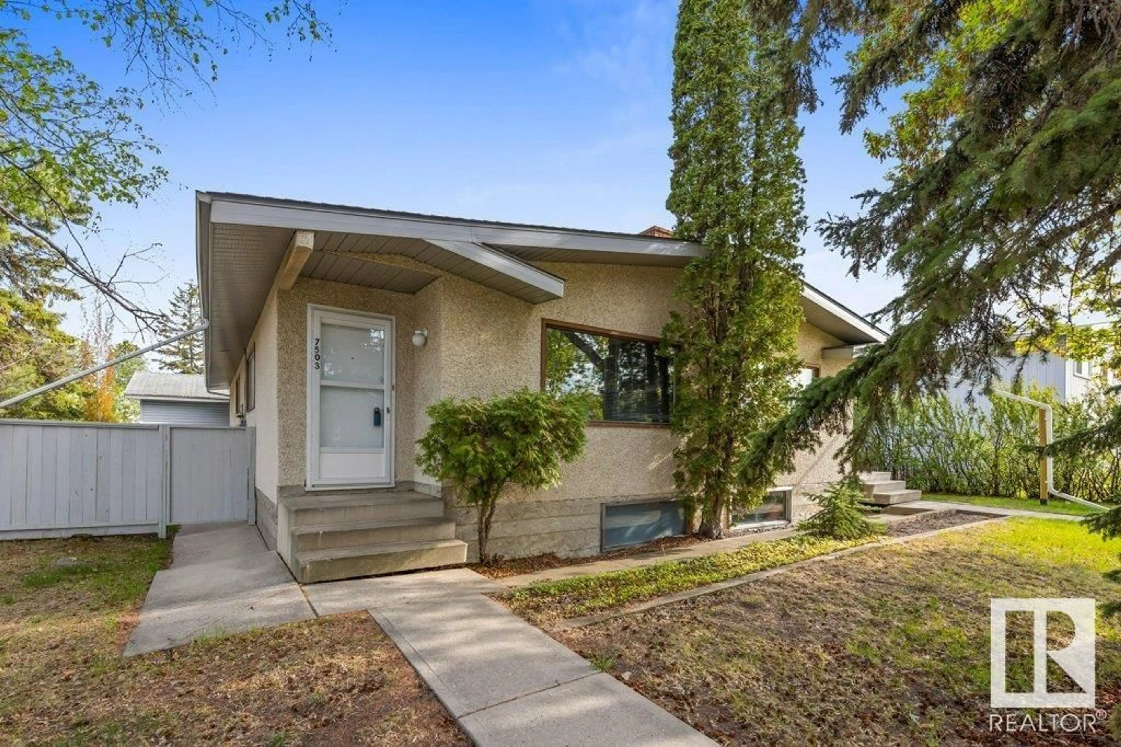 Home with vinyl exterior material, street for NW - 7503 36B AV, Edmonton Alberta T6K0L4