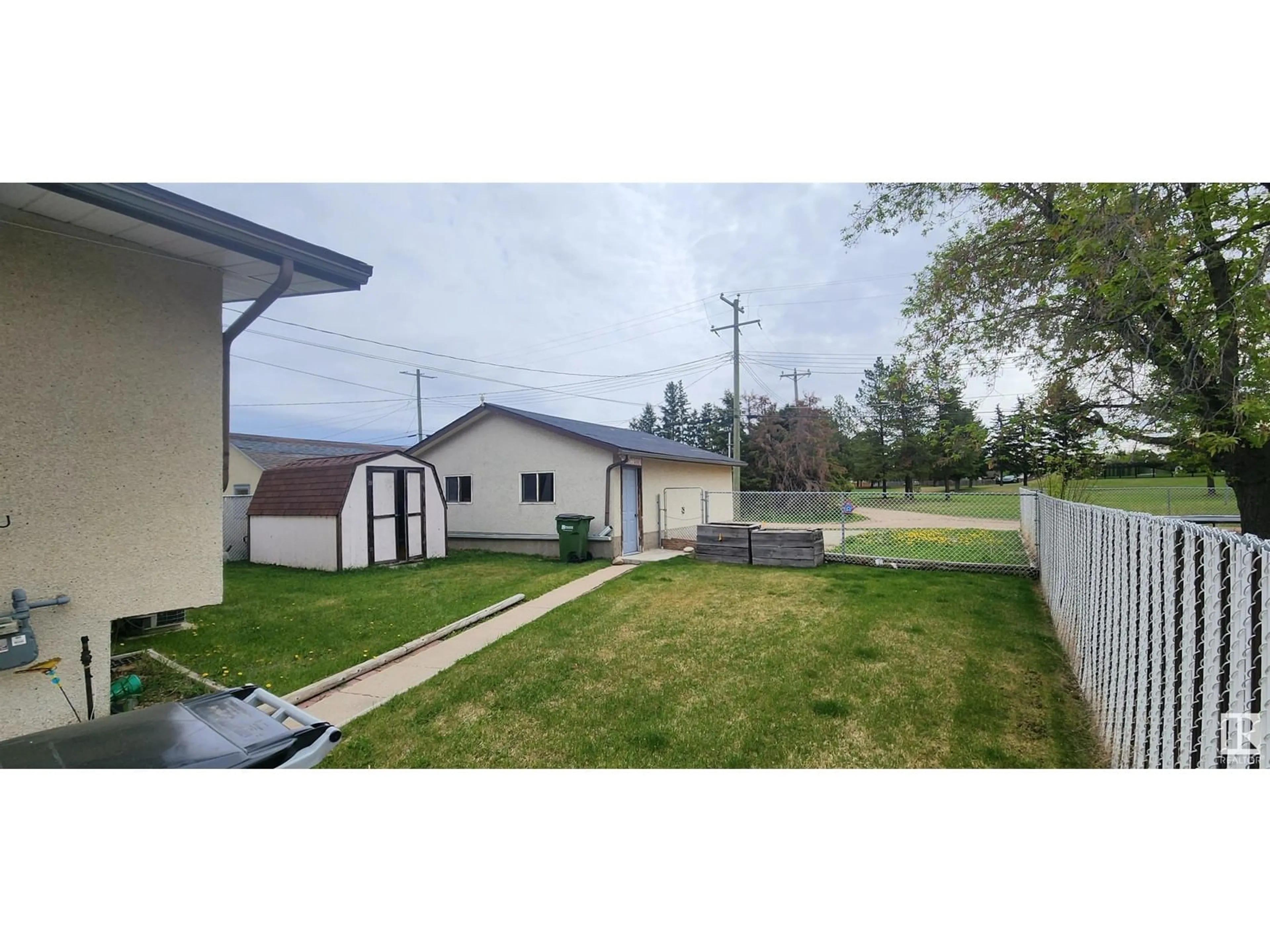 A pic from outside/outdoor area/front of a property/back of a property/a pic from drone, street for 10639 104 ST, Westlock Alberta T7P1L8