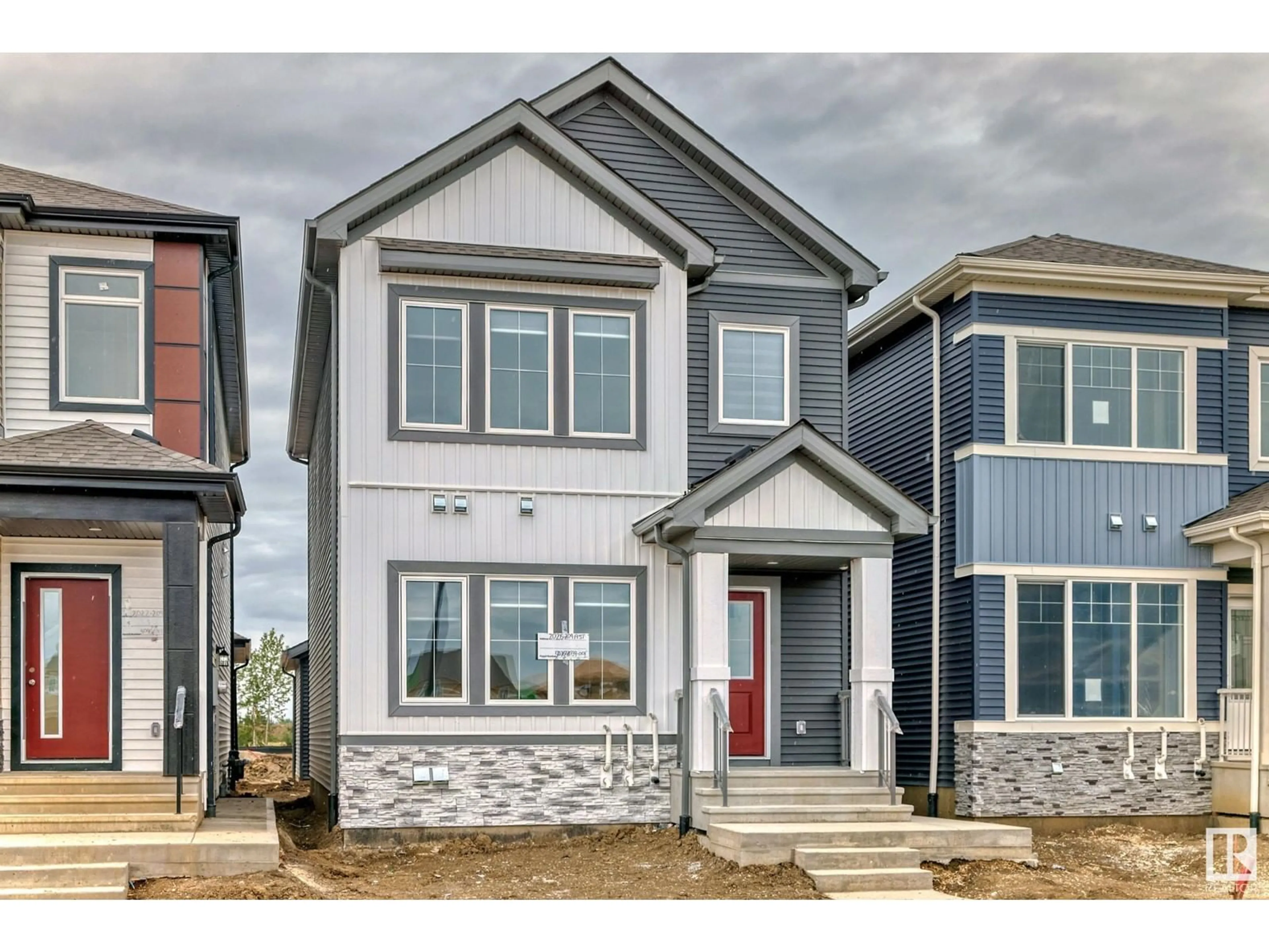 Home with vinyl exterior material, street for 1943 210 NW, Edmonton Alberta T6M3H5