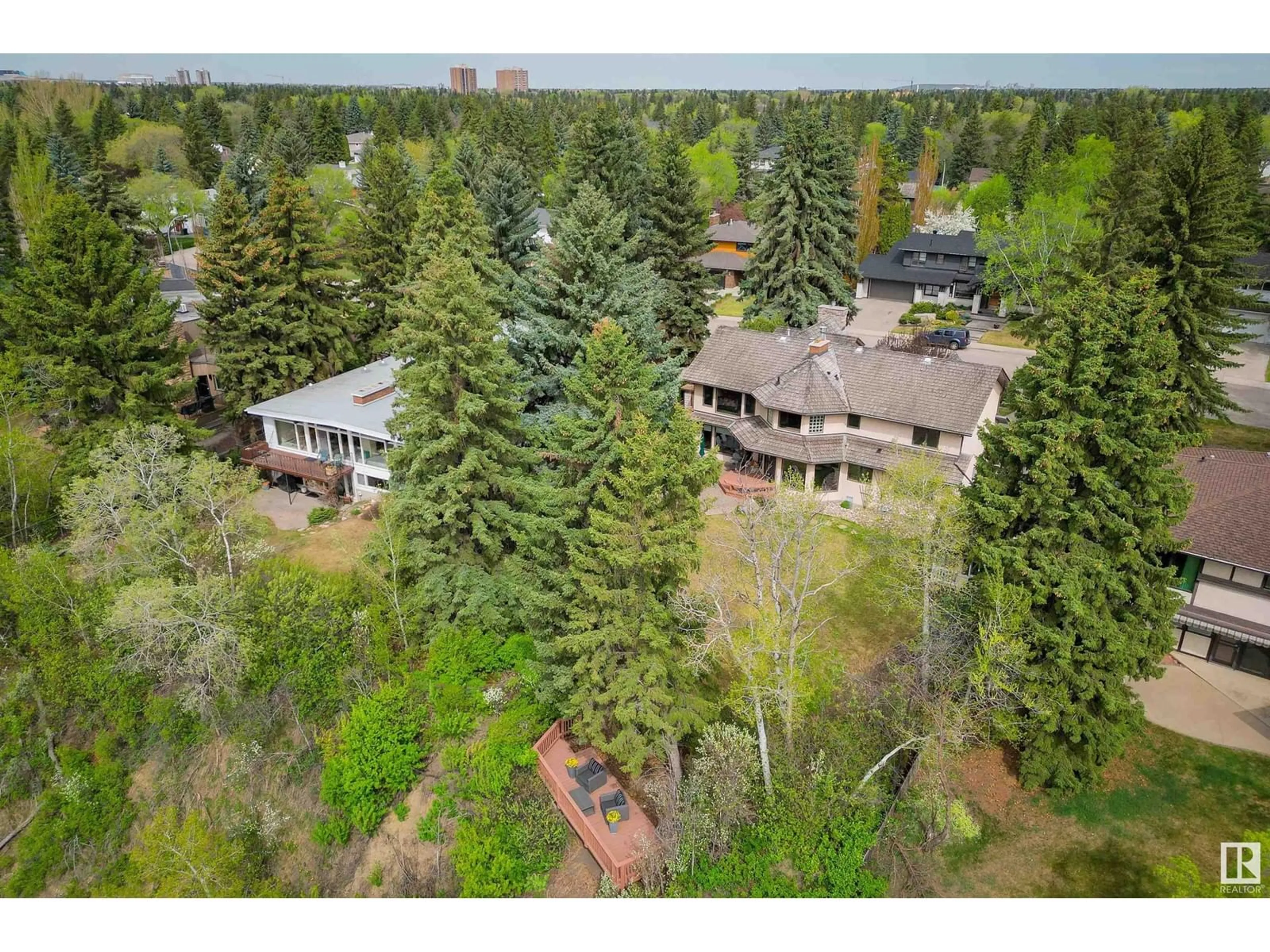 A pic from outside/outdoor area/front of a property/back of a property/a pic from drone, forest/trees view for 151 QUESNELL CR, Edmonton Alberta T5R5P1