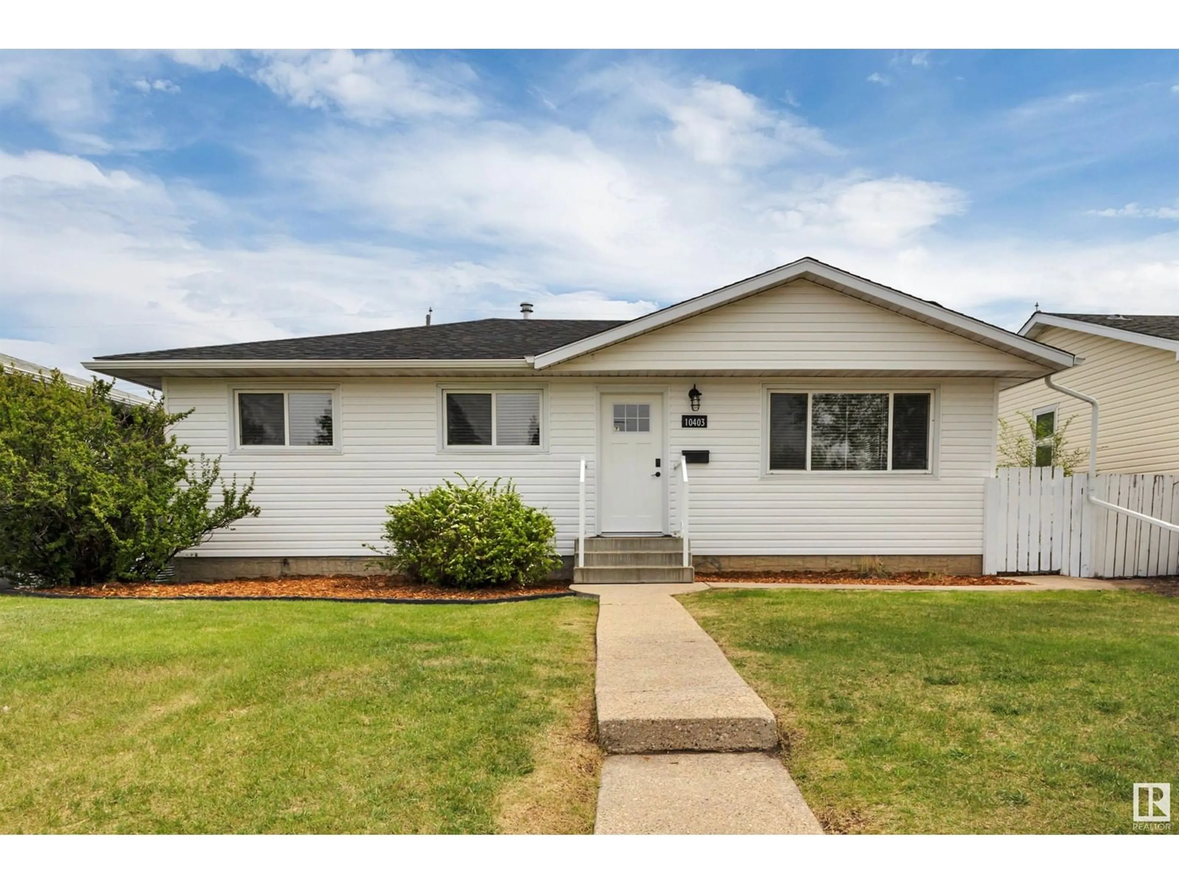 Home with vinyl exterior material, street for 10403 42 ST, Edmonton Alberta T6A1T3