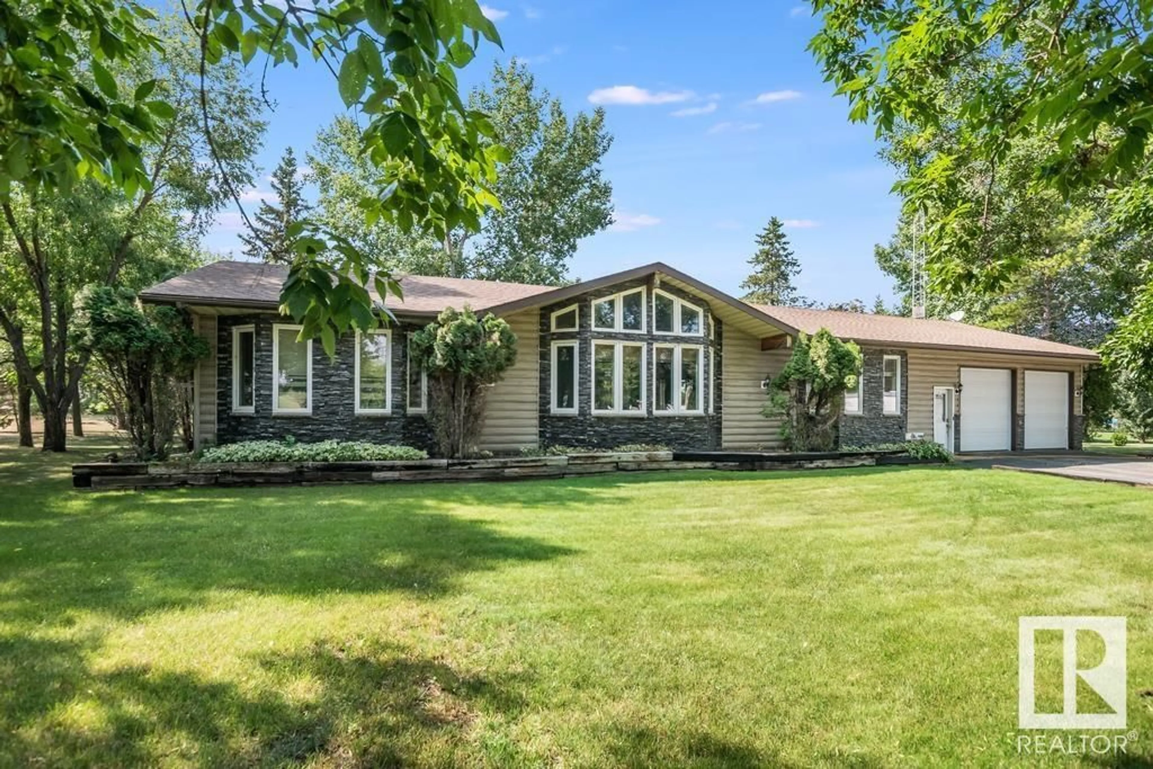 Home with vinyl exterior material, street for #402 - 46410 TWP RD 610, Rural Bonnyville M.D. Alberta T9N2J1