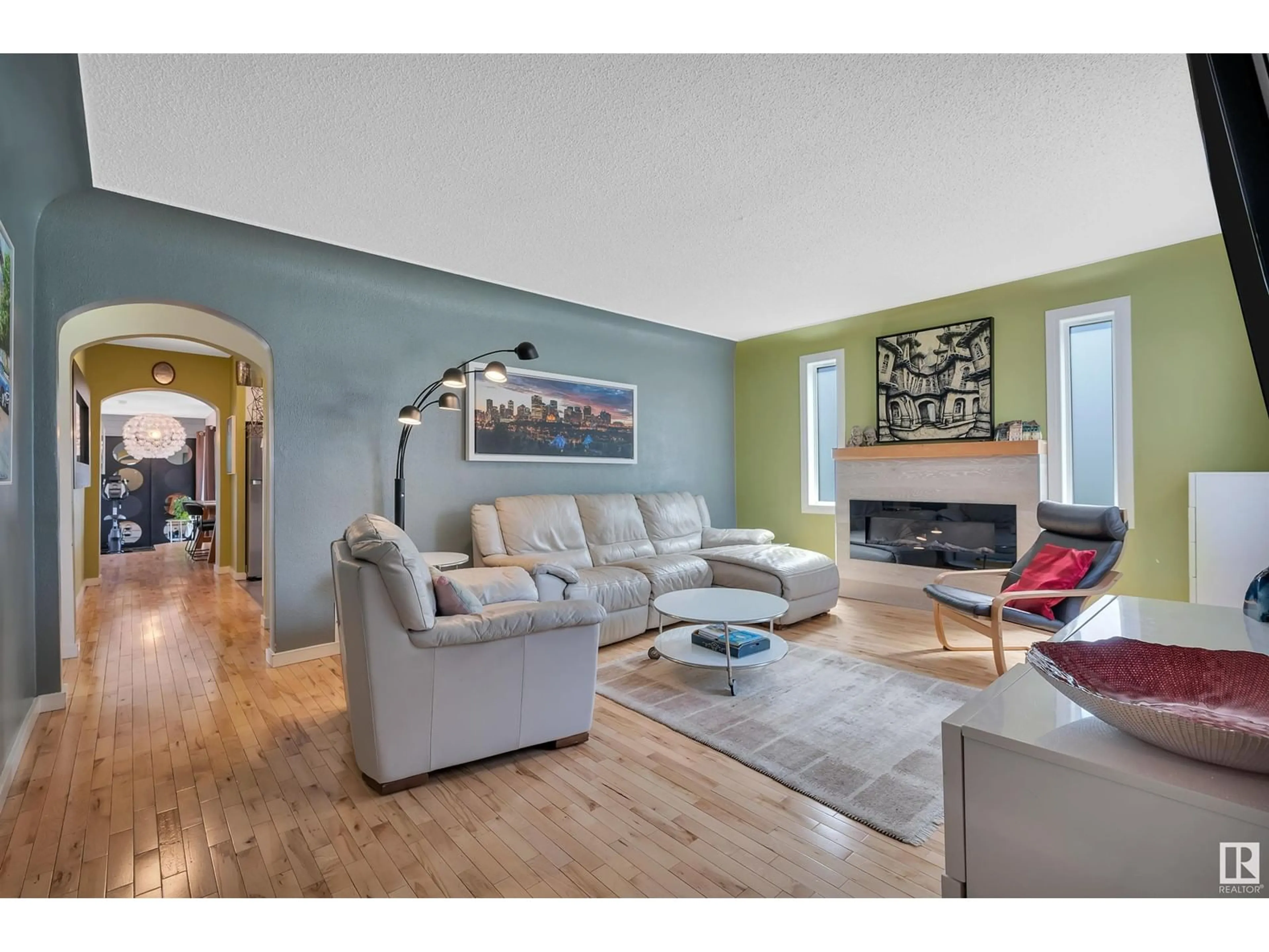 Living room with furniture, wood/laminate floor for NW - 11519 102 ST, Edmonton Alberta T5G2E8