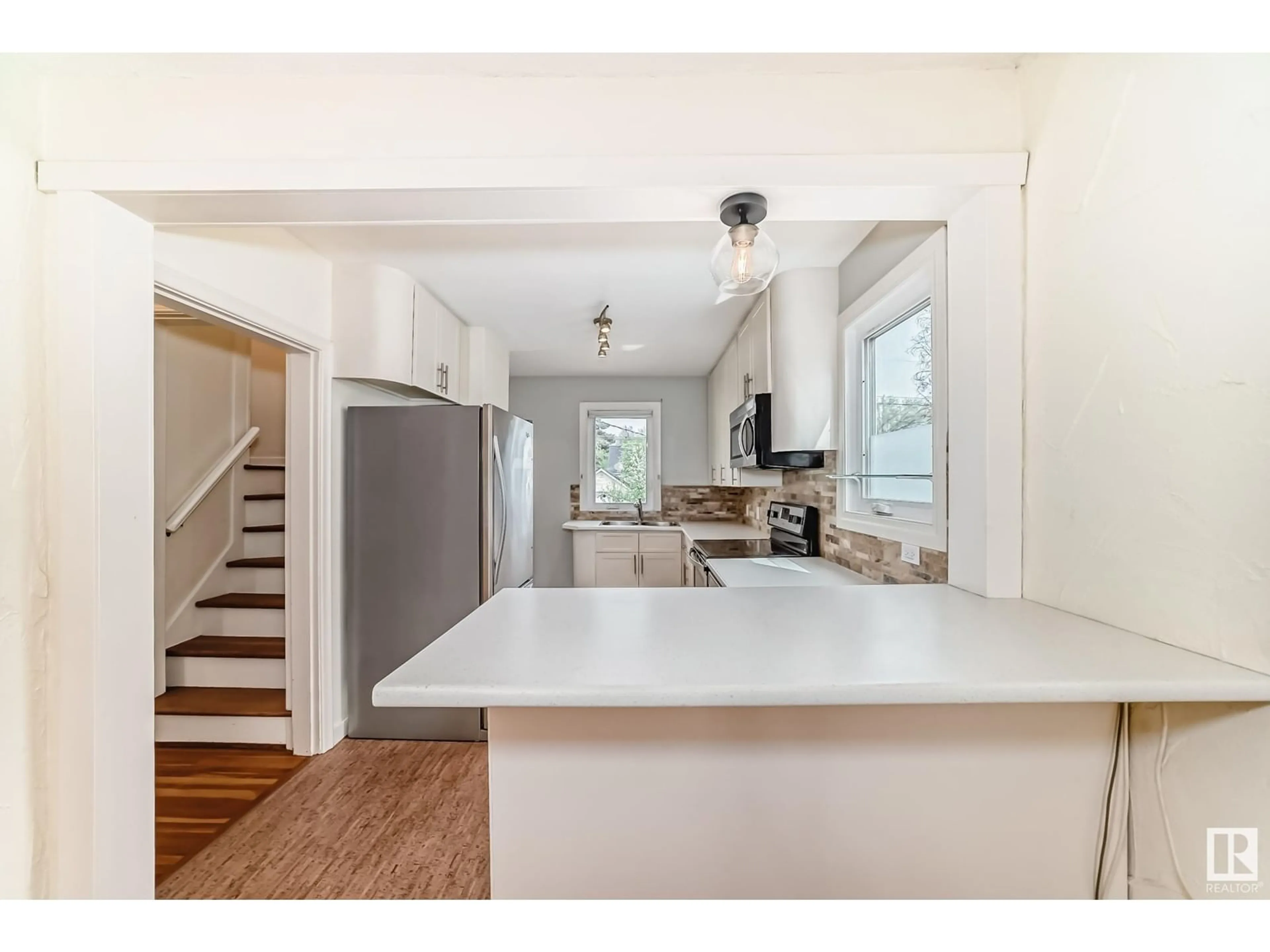 Open concept kitchen, unknown for 7720 77 AV, Edmonton Alberta T6C0K7