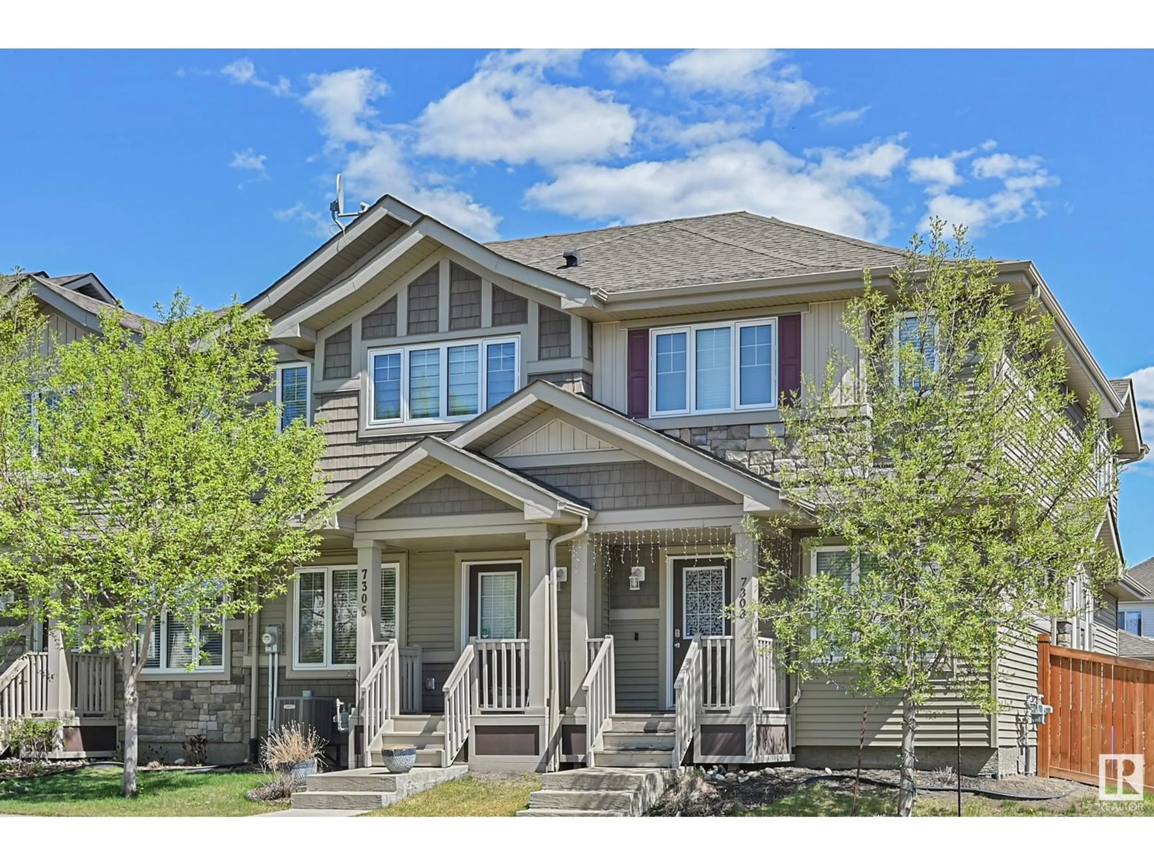 Home with vinyl exterior material, street for 7303 EDGEMONT WY, Edmonton Alberta T6M0T7