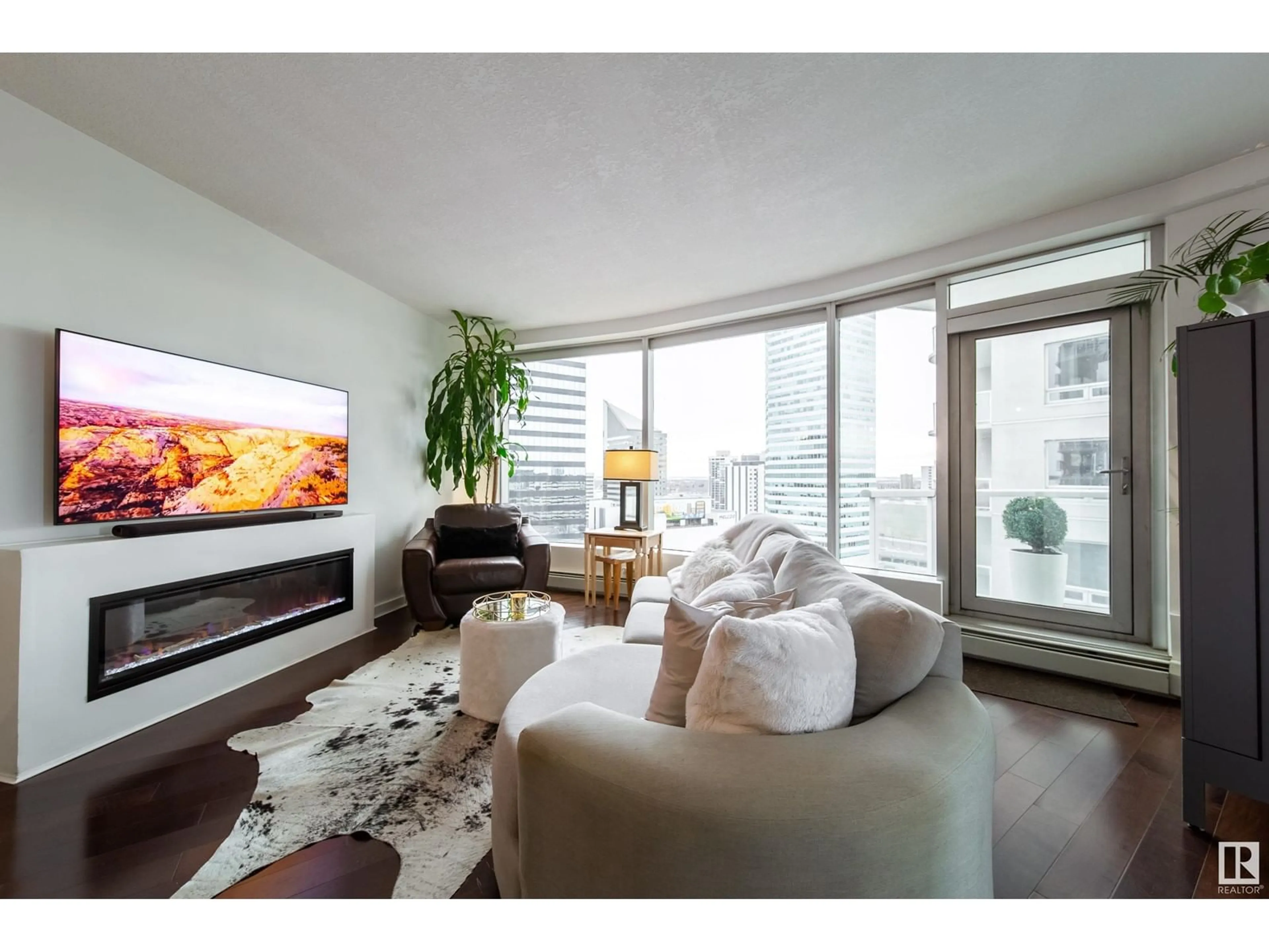 Living room with furniture, wood/laminate floor for 1504 - 10152 104 ST, Edmonton Alberta T5J0B6