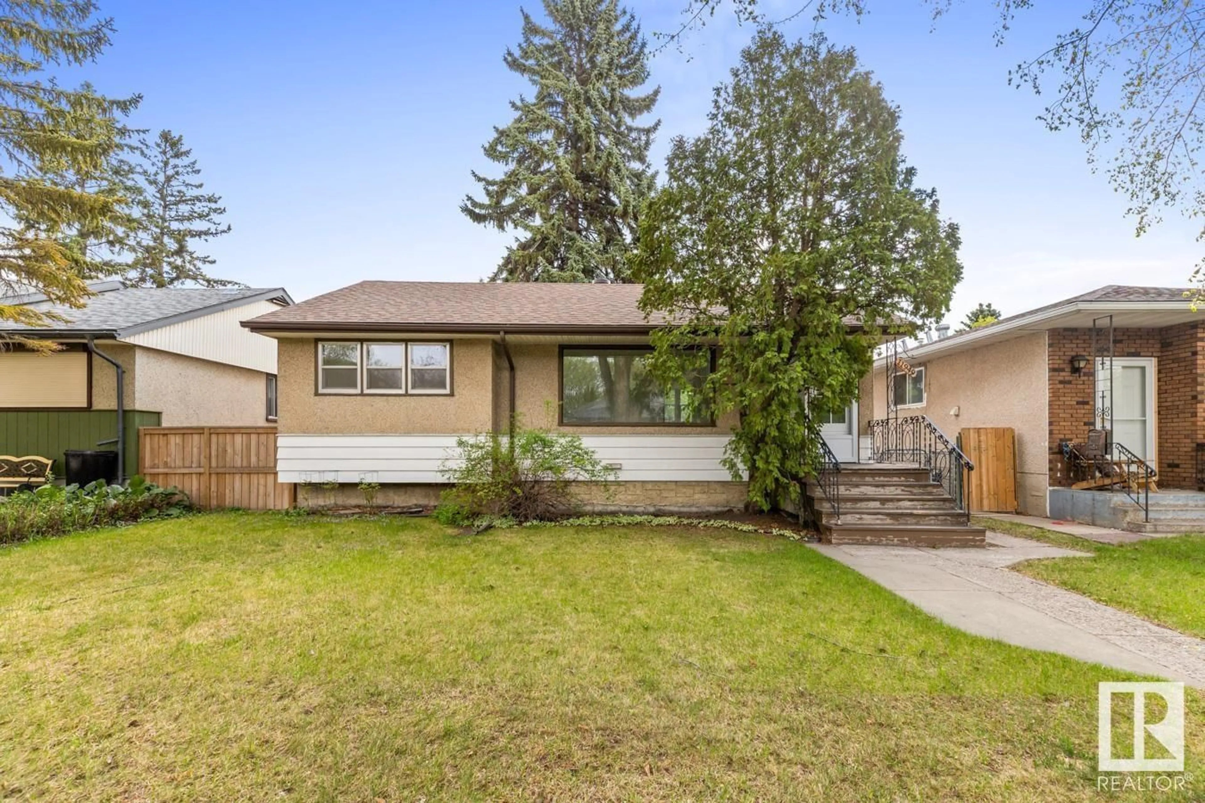 Home with vinyl exterior material, street for 11949 51 ST, Edmonton Alberta T5W3G5
