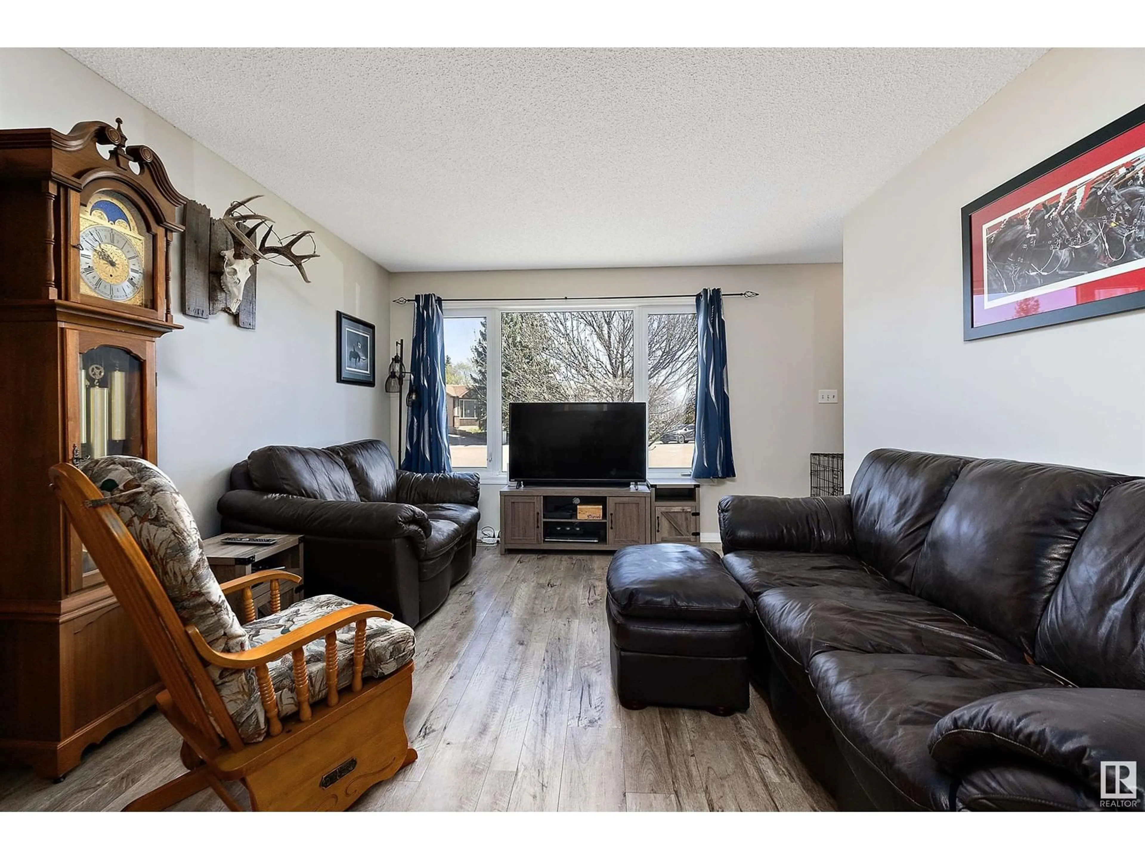Living room with furniture, wood/laminate floor for 4013 43B AVE, Leduc Alberta T9E4V2