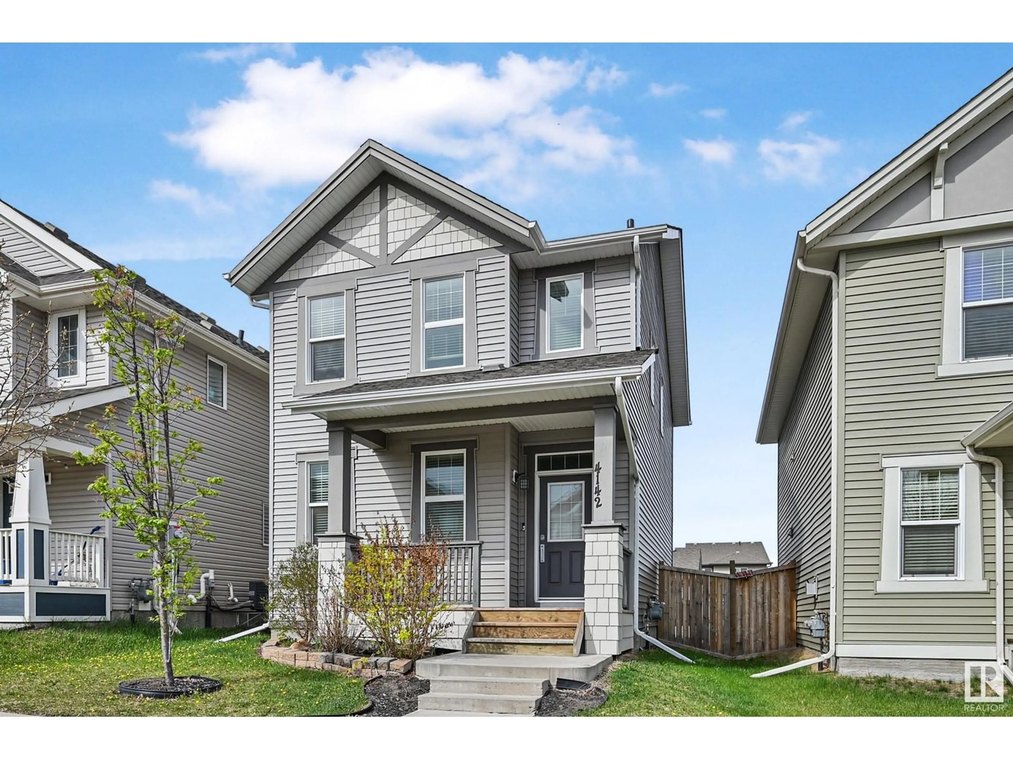 Home with vinyl exterior material, street for NW - 4142 6A ST, Edmonton Alberta T6T0T6