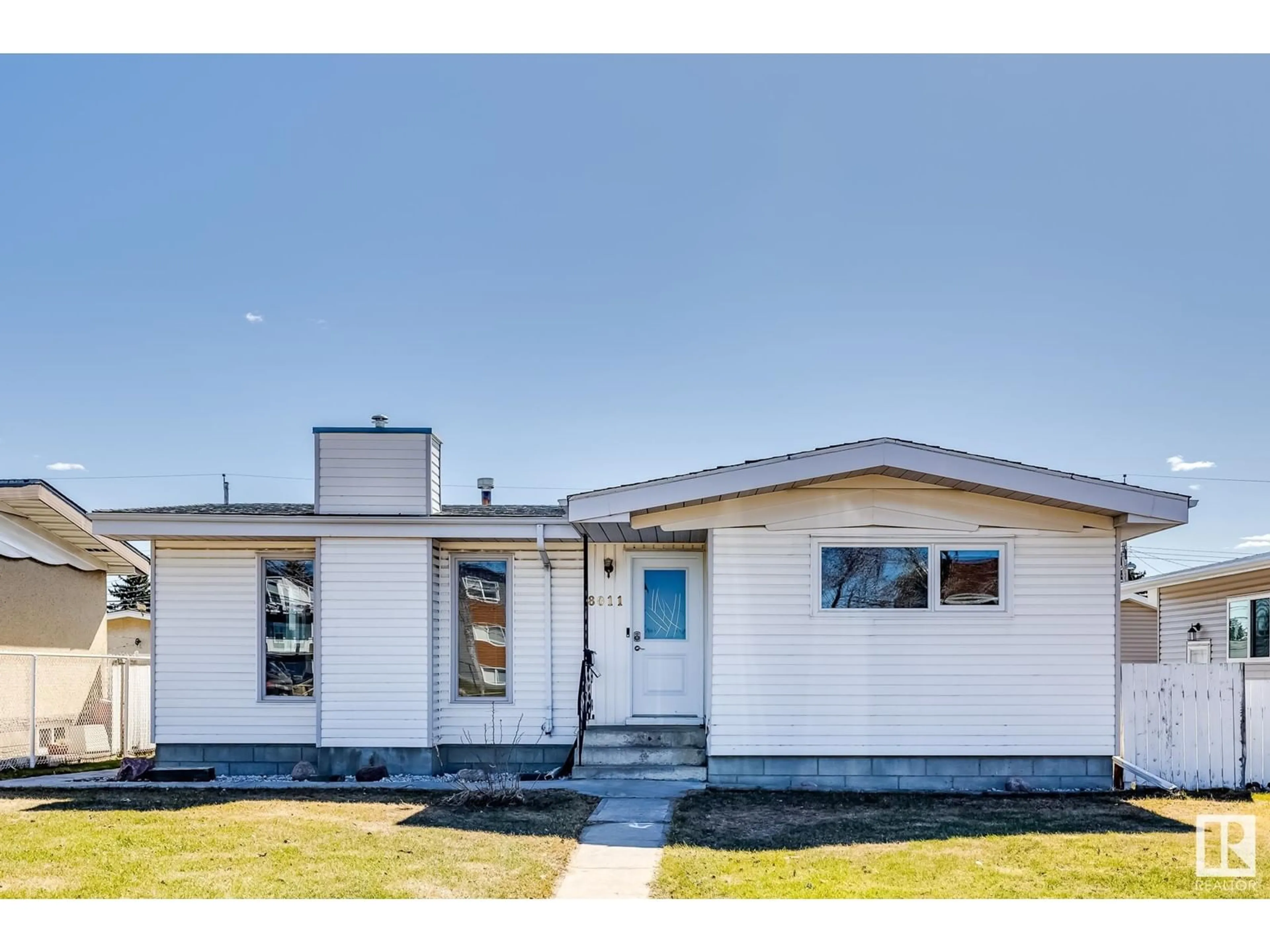 Home with vinyl exterior material, street for 8011 132 AV, Edmonton Alberta T5C2B3