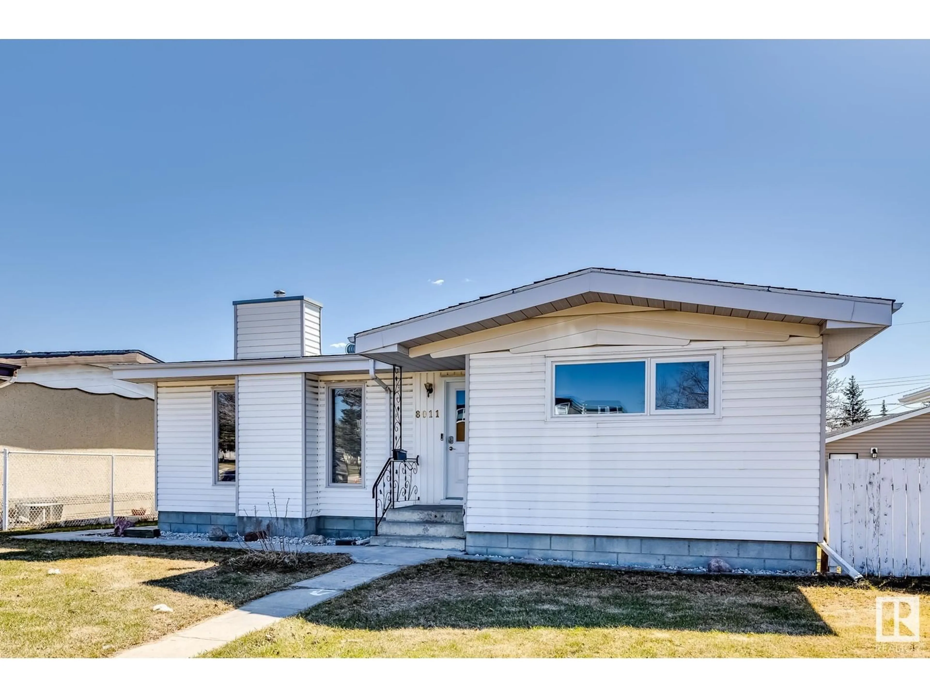 Home with vinyl exterior material, street for 8011 132 AV, Edmonton Alberta T5C2B3