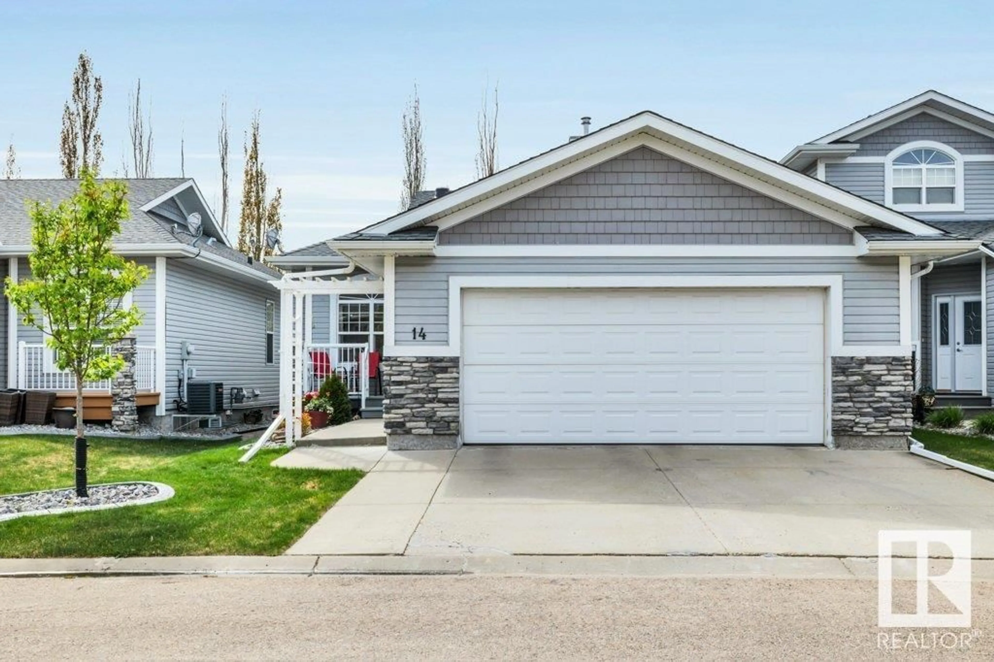 Home with vinyl exterior material, street for 14 - 26116 HGHWAY 16, Rural Parkland County Alberta T7Y1A1