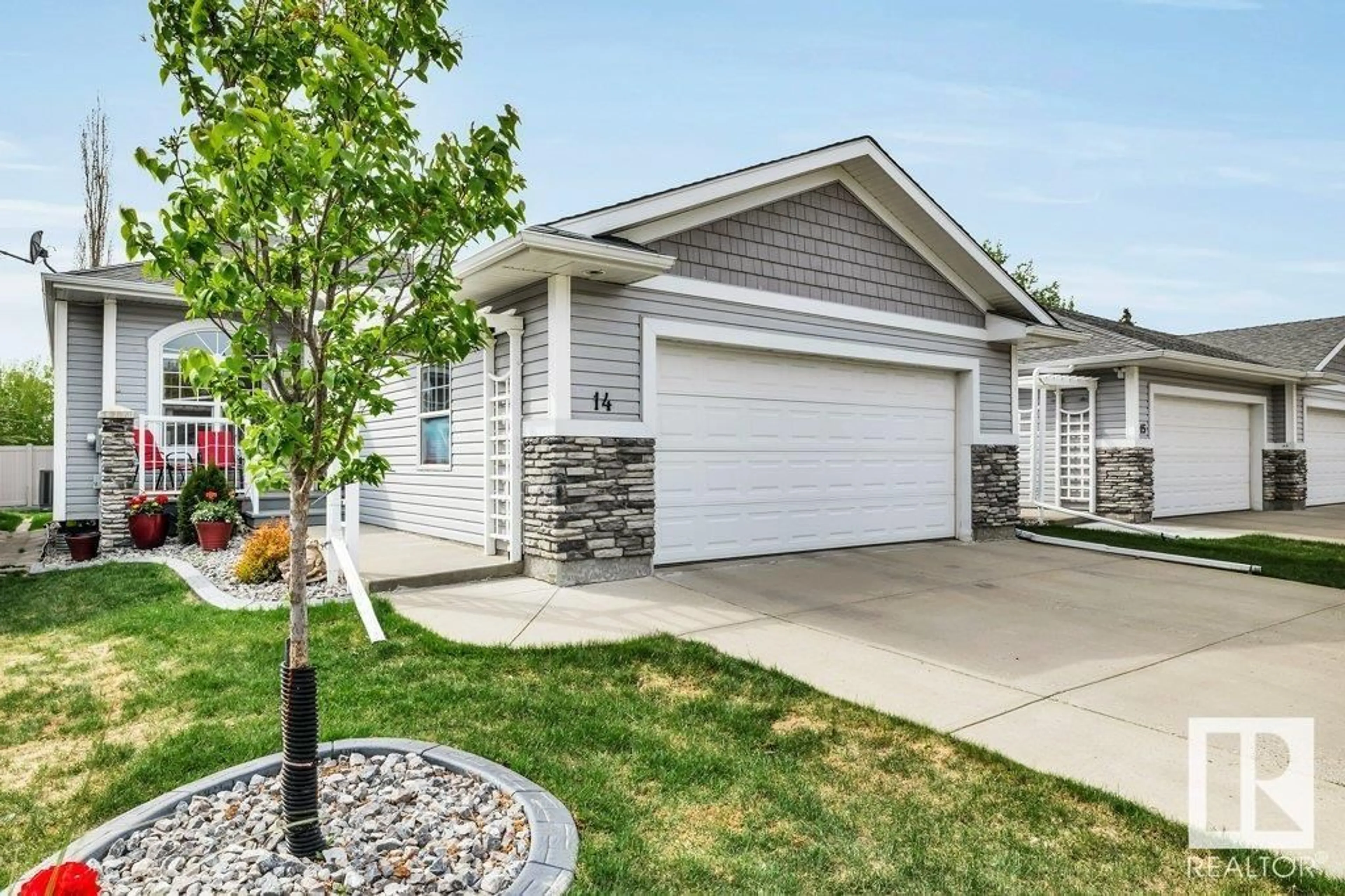 Home with vinyl exterior material, street for 14 - 26116 HGHWAY 16, Rural Parkland County Alberta T7Y1A1