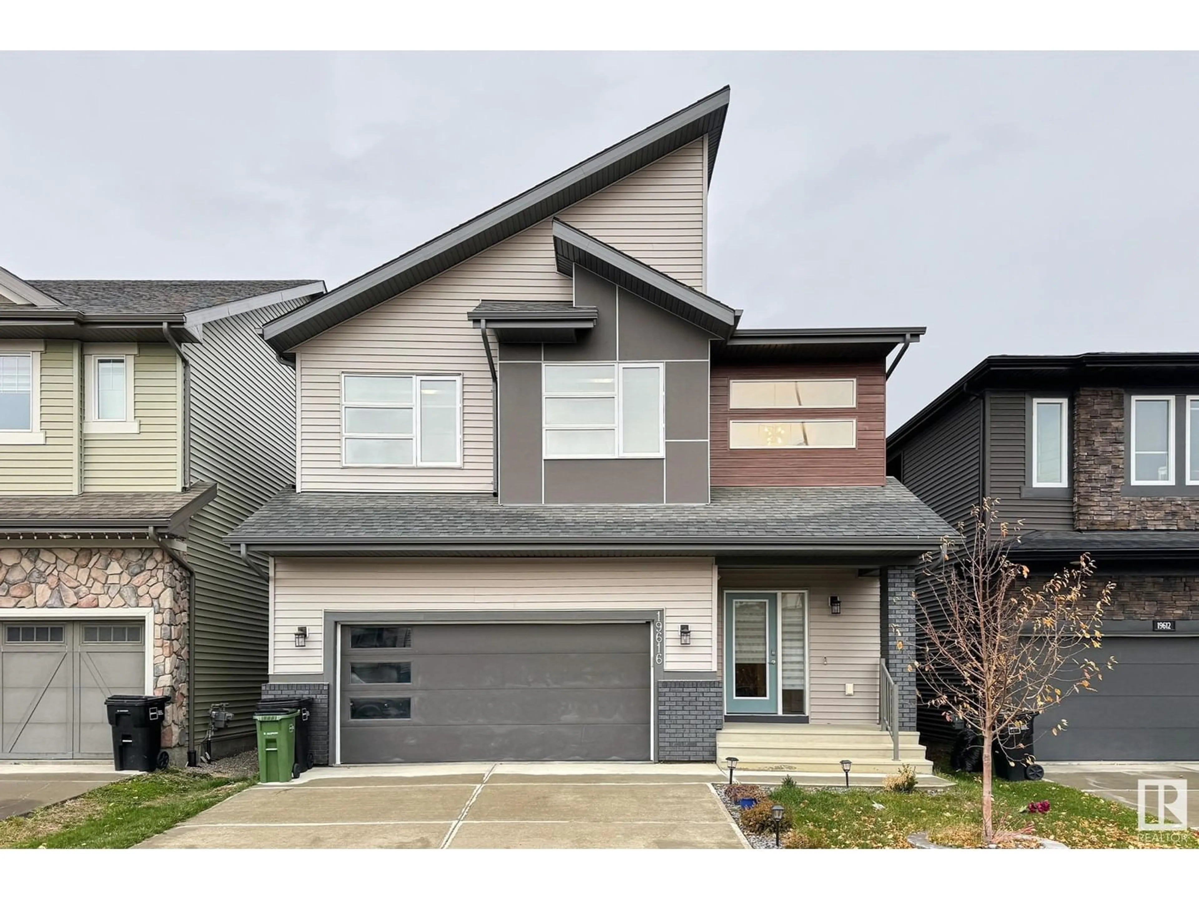 Home with vinyl exterior material, street for 19616 26 AV, Edmonton Alberta T6M0X4