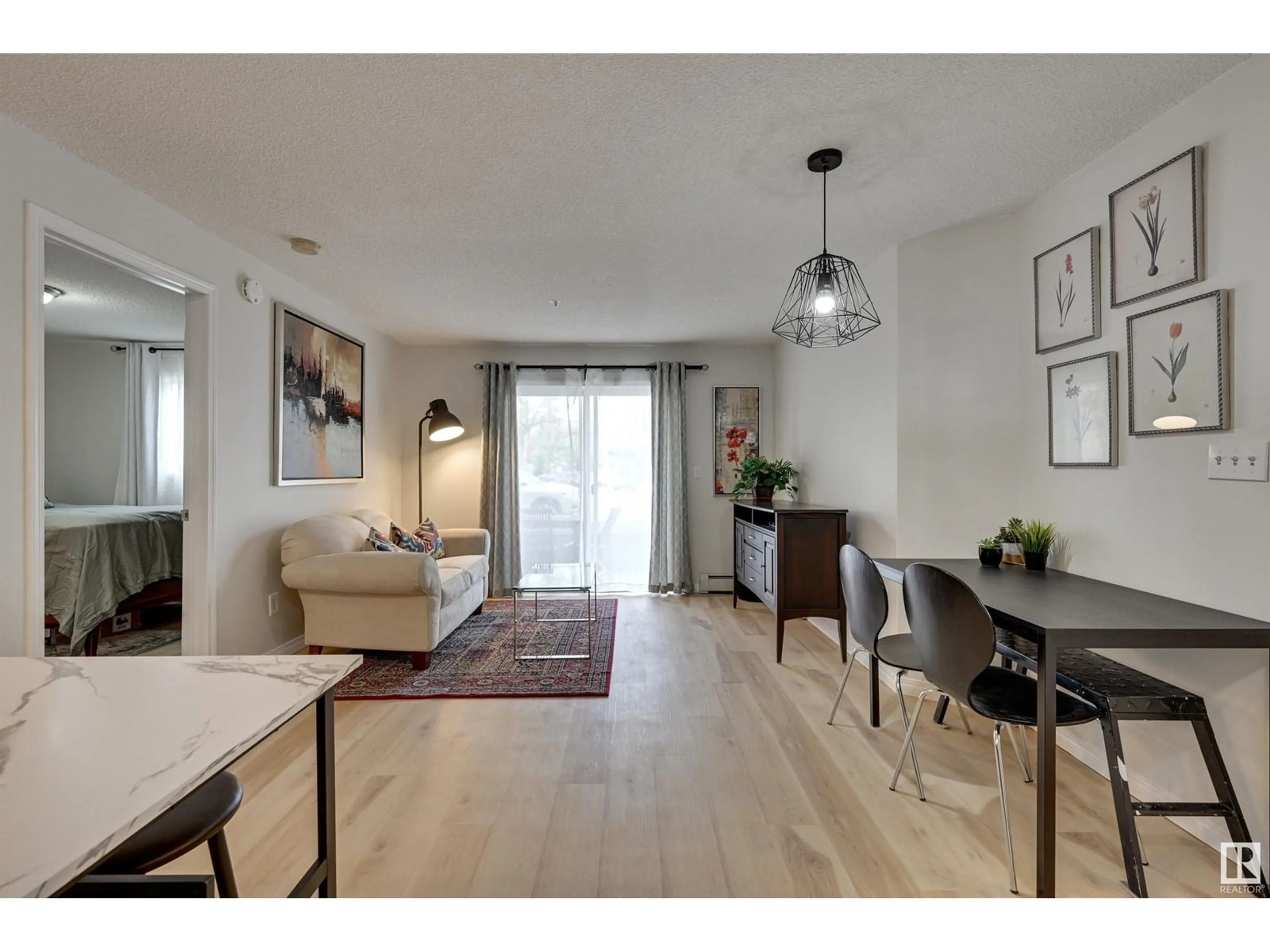Living room with furniture, wood/laminate floor for #109 - 10535 122 ST, Edmonton Alberta T5N4B7
