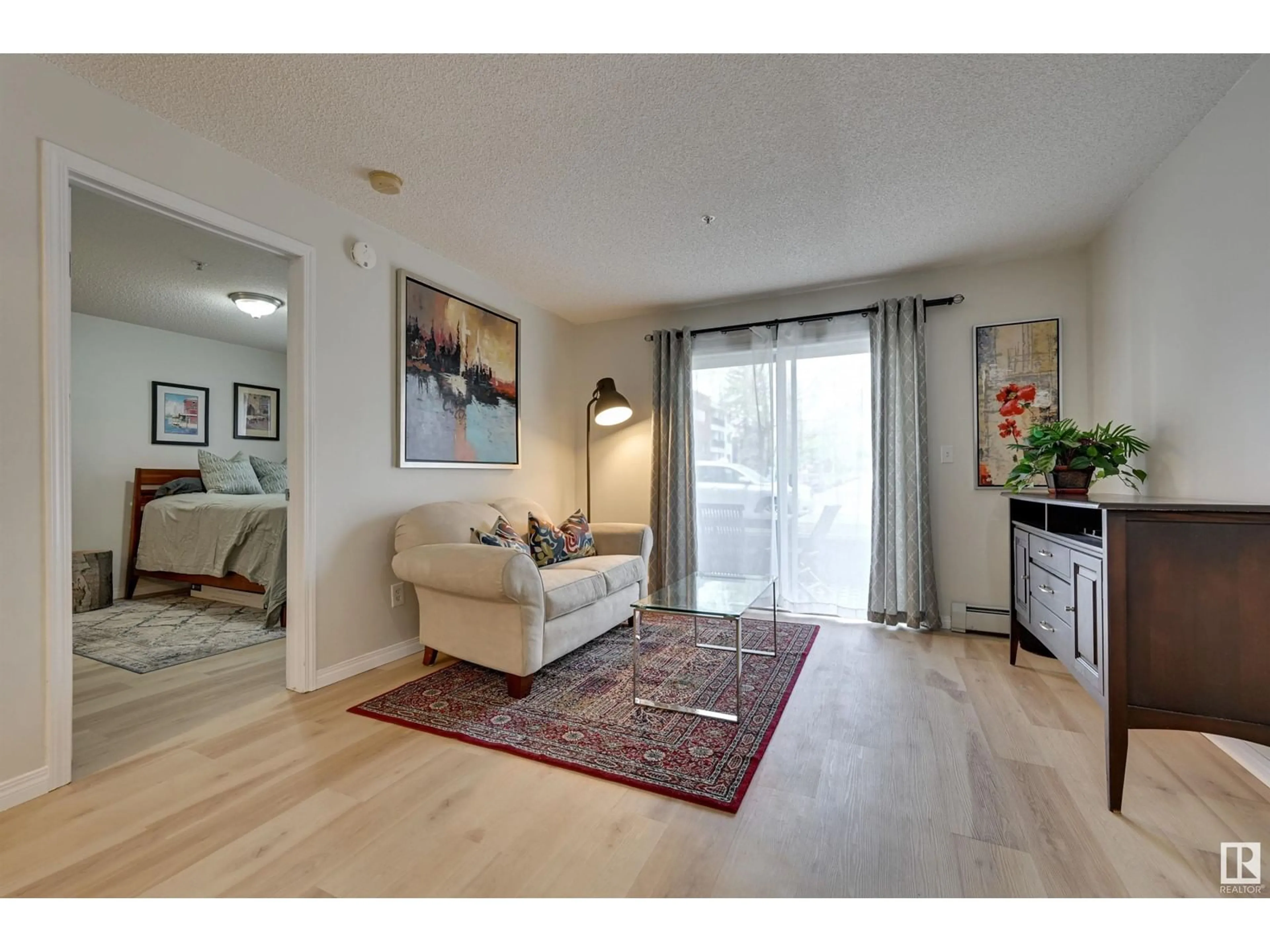 Living room with furniture, wood/laminate floor for #109 - 10535 122 ST, Edmonton Alberta T5N4B7