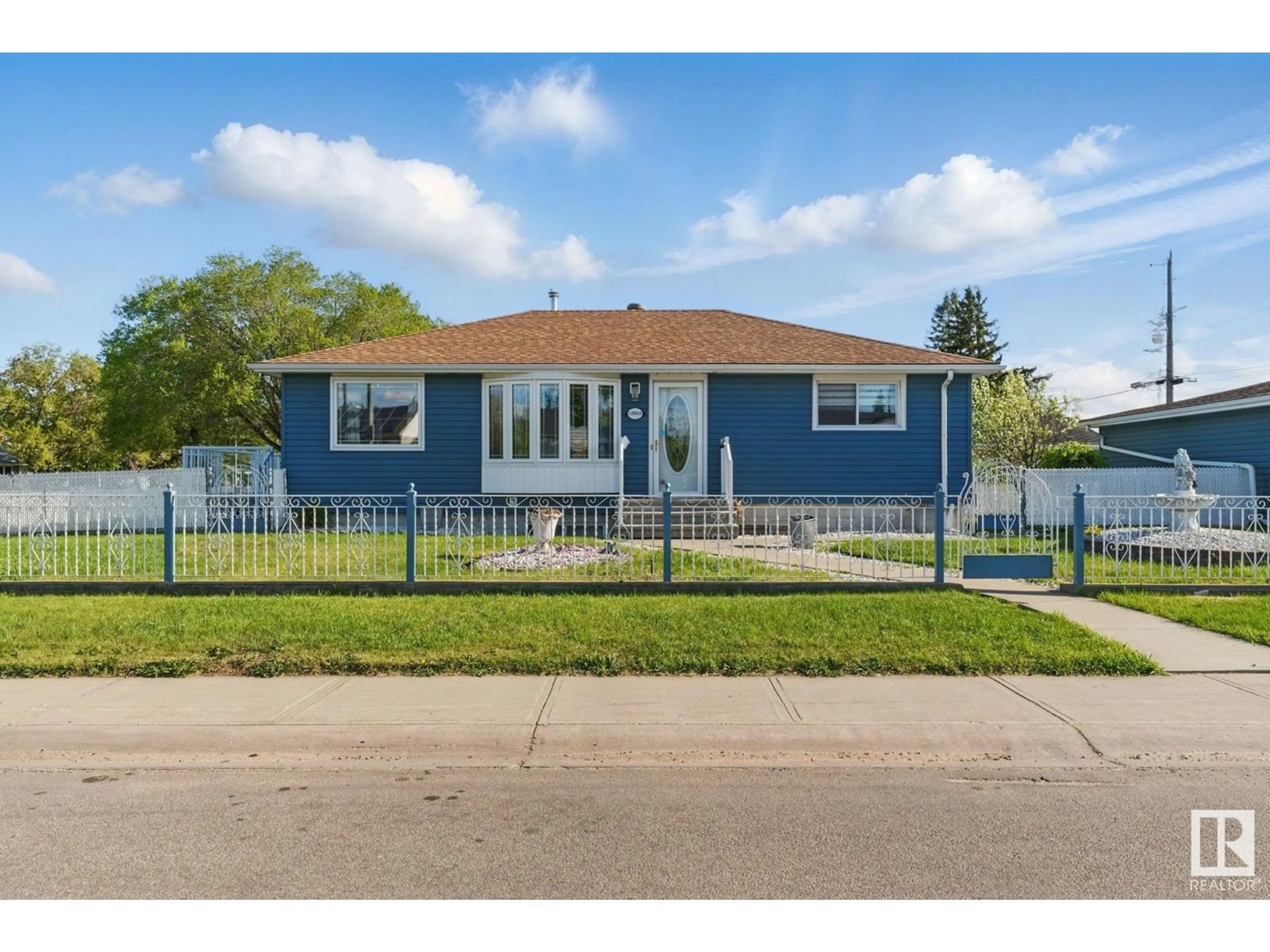 Home with vinyl exterior material, street for 13903 135 AV, Edmonton Alberta T5L3Z1