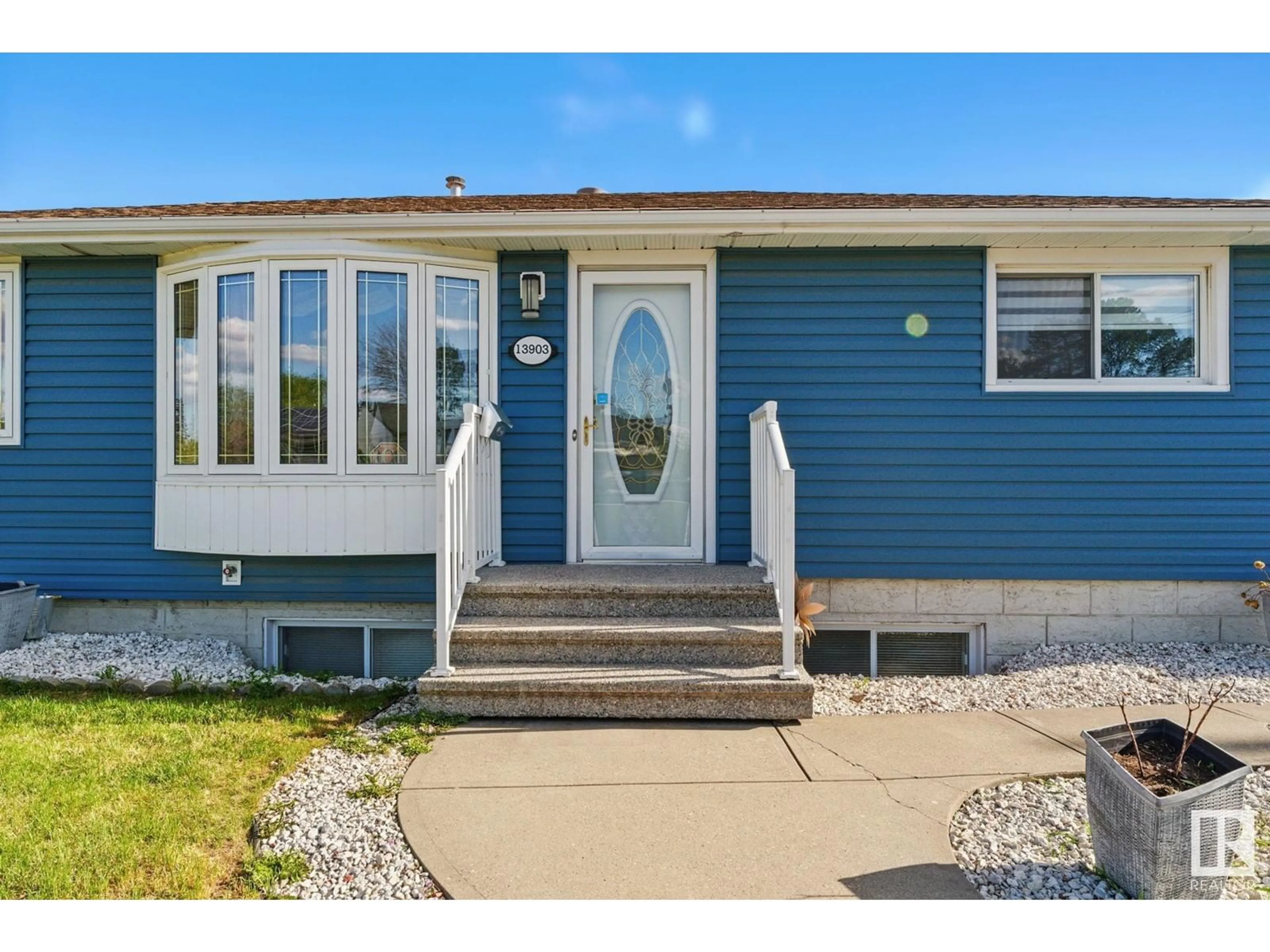 Home with vinyl exterior material, street for 13903 135 AV, Edmonton Alberta T5L3Z1