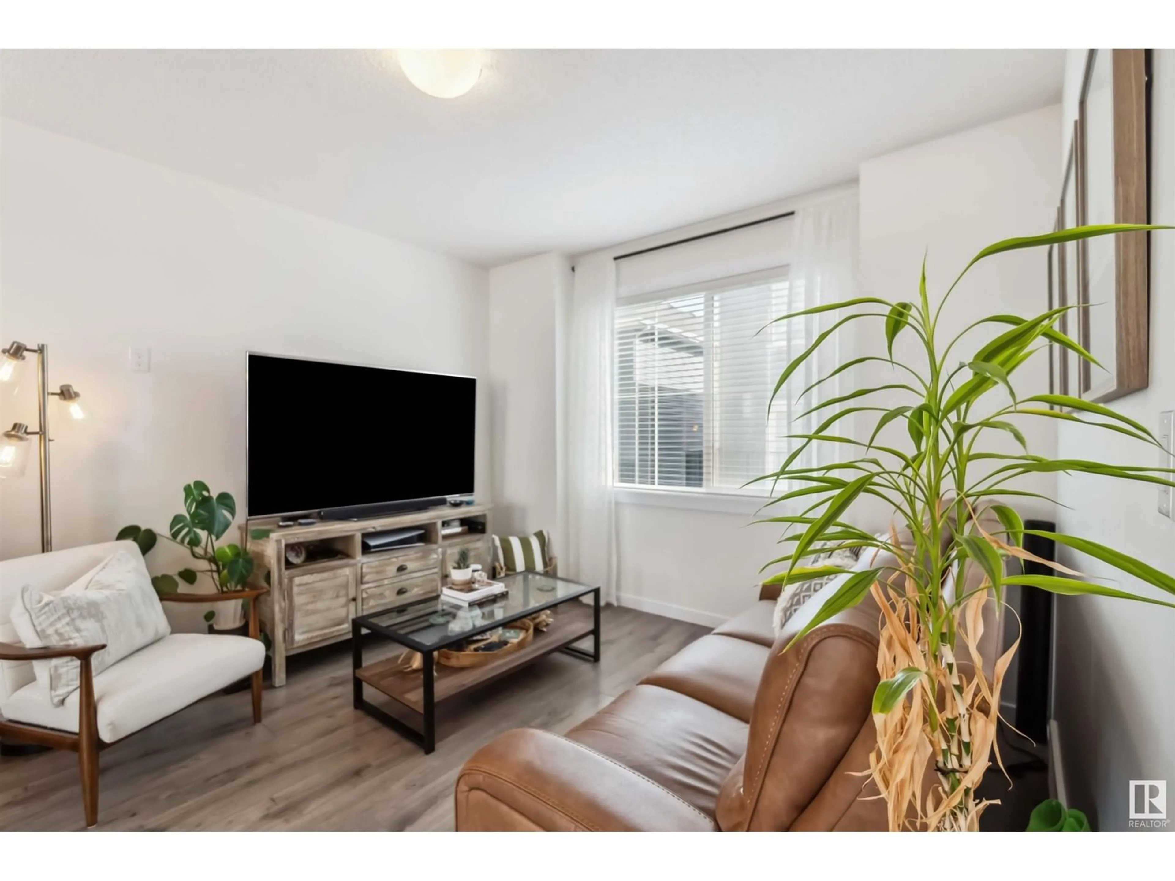 Living room with furniture, wood/laminate floor for 735 - 19 ALLARD BV, Edmonton Alberta T6W3W5