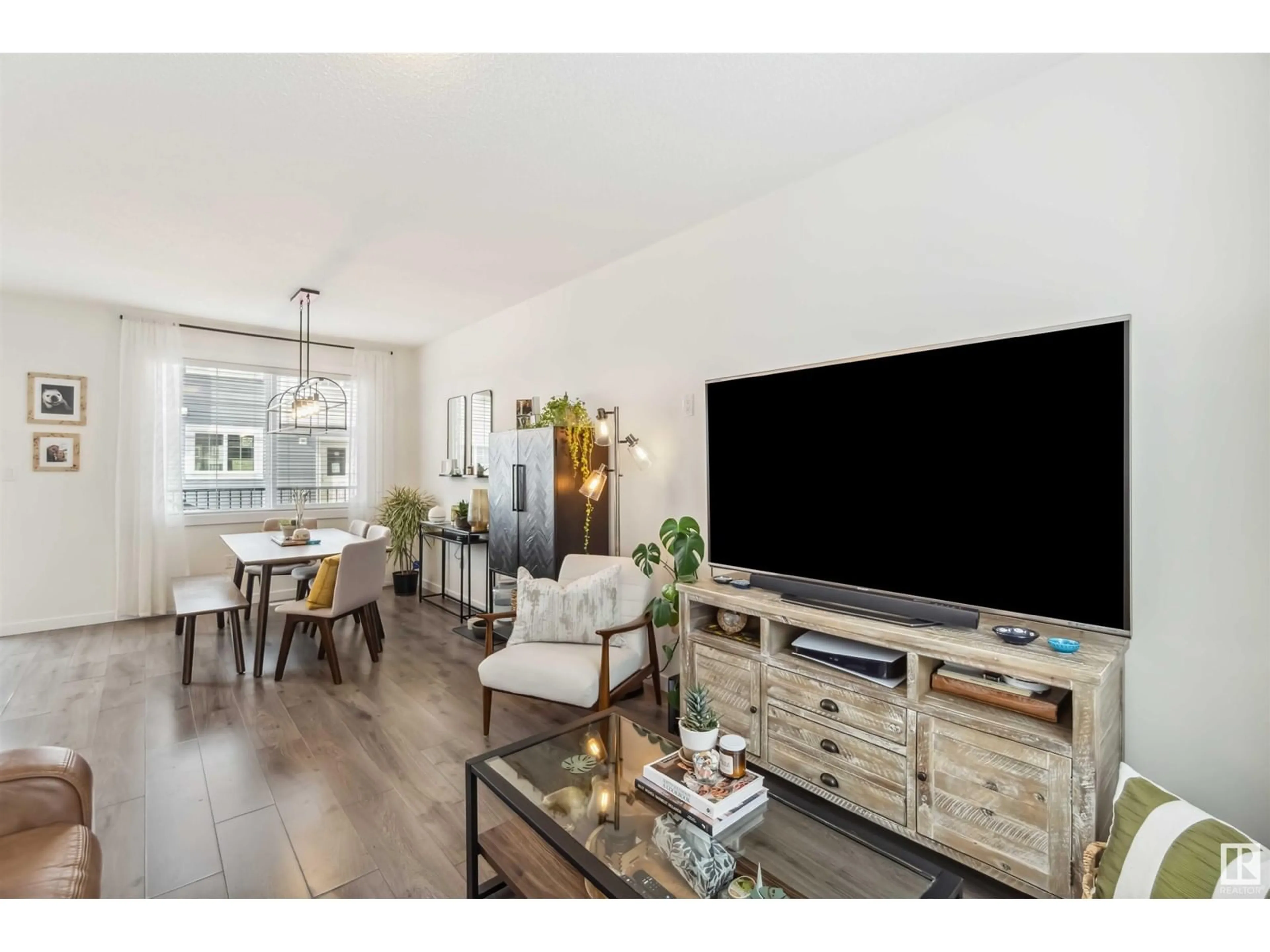 Living room with furniture, wood/laminate floor for 735 - 19 ALLARD BV, Edmonton Alberta T6W3W5
