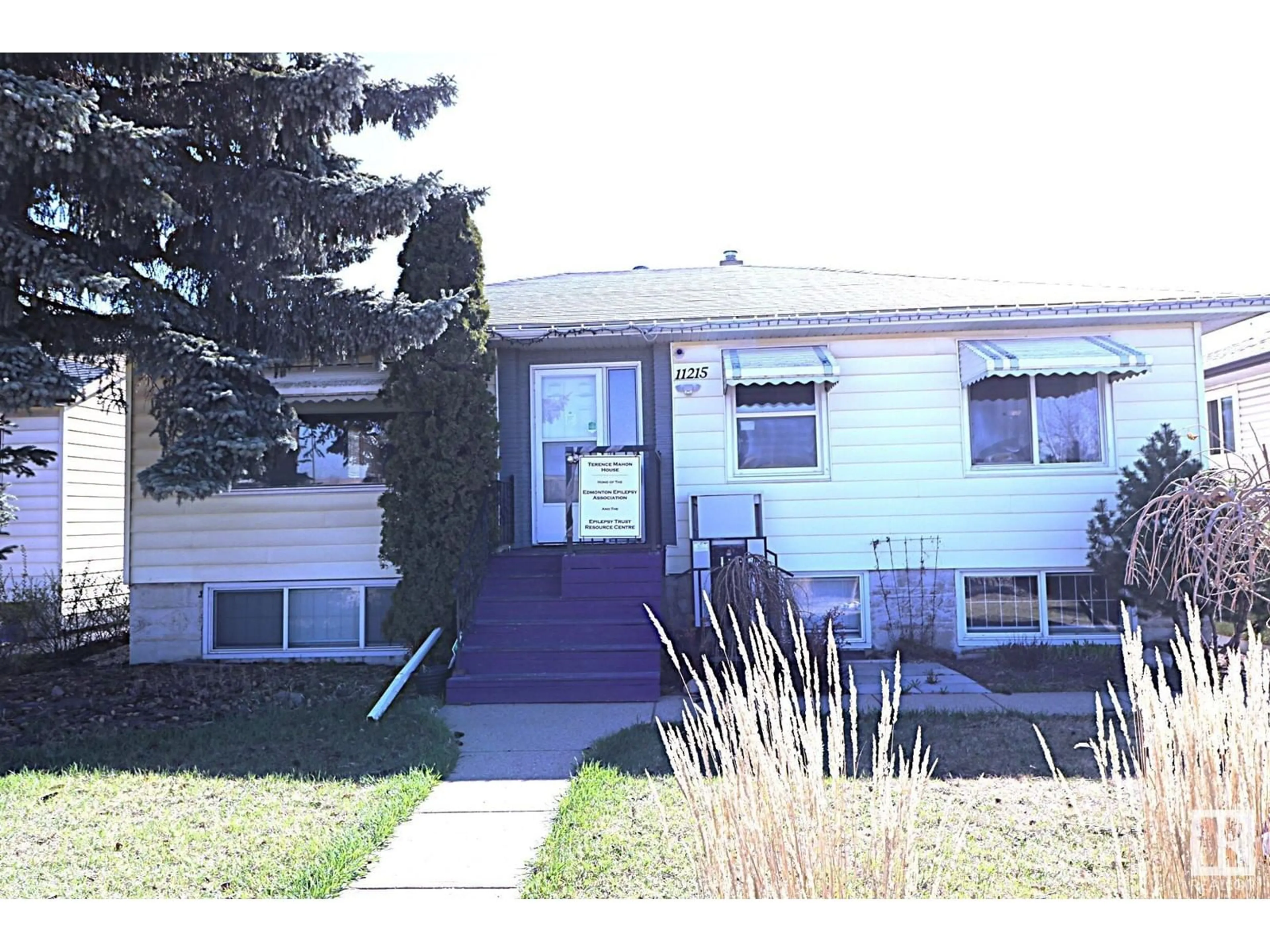 Home with vinyl exterior material, street for 11215 GROAT RD, Edmonton Alberta T5M3K2