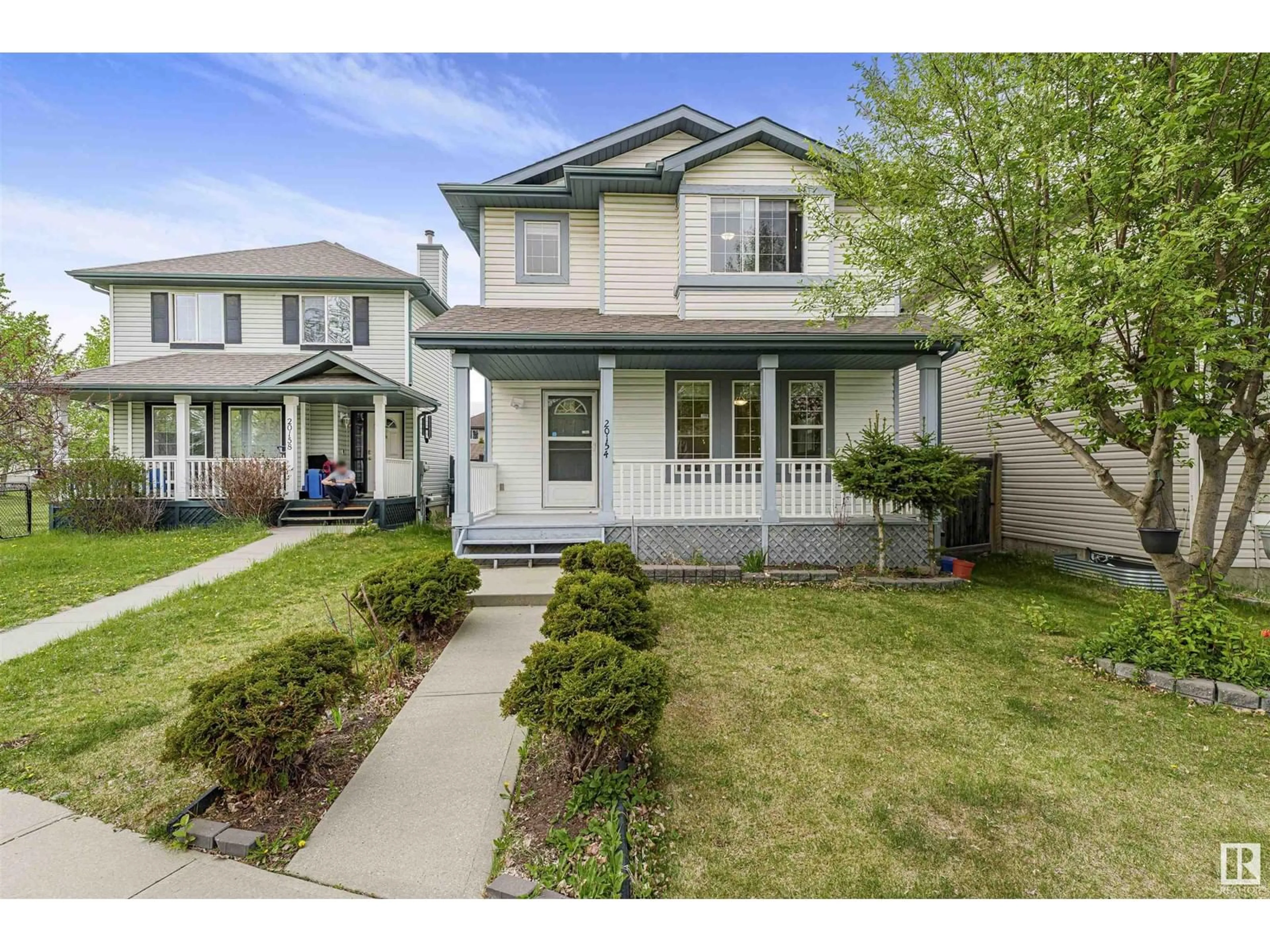 Home with vinyl exterior material, street for 20154 53 AV, Edmonton Alberta T6M2W3